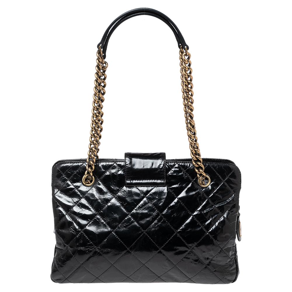 All of Chanel's designs are made with high attention to style and craftsmanship. This Reissue tote has been created with the same dedication from crackled glazed leather and held by two handles. The bag features a Mademoiselle lock on the flap and