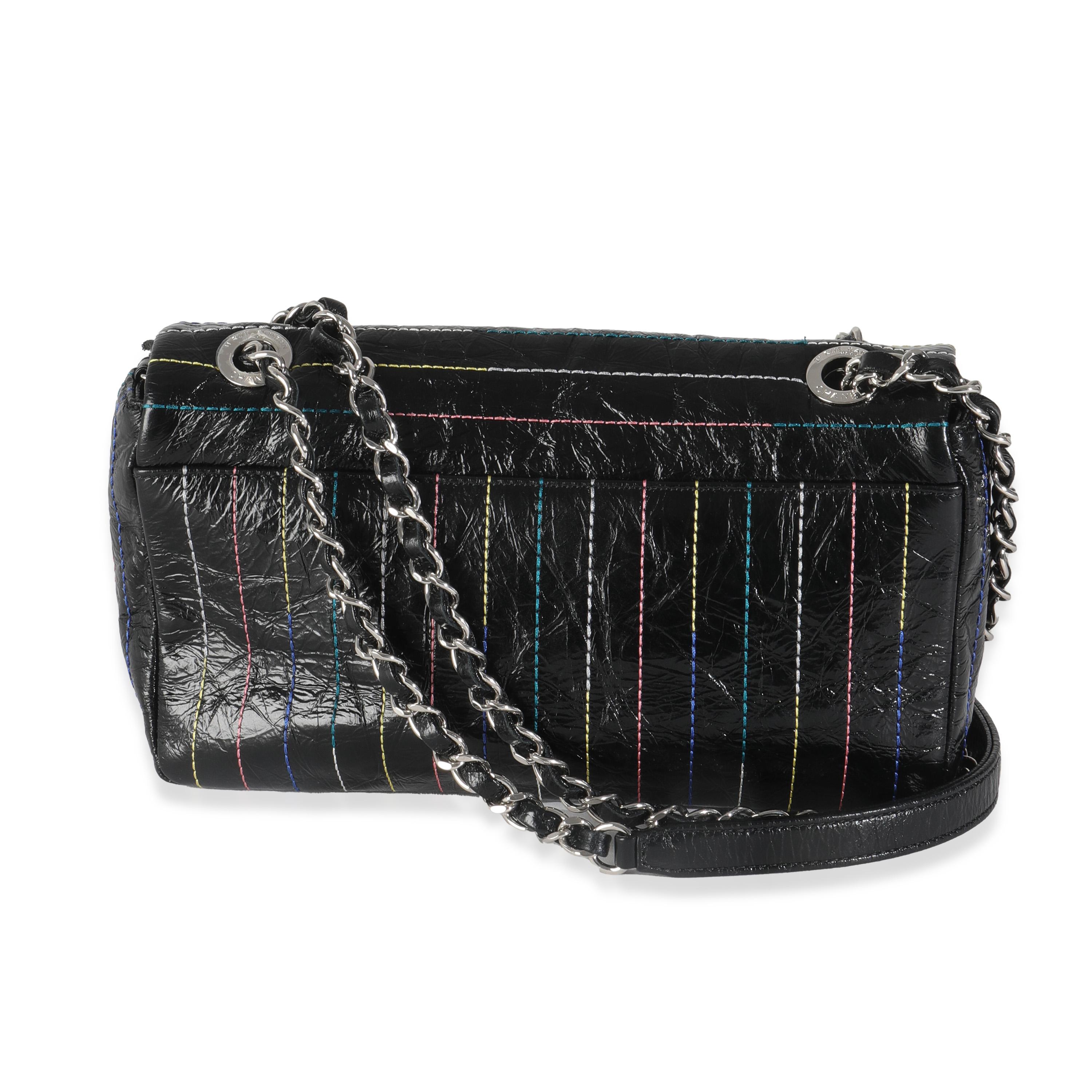 Listing Title: Chanel Black Crinkle Patent Multicolor Stitch Single Flap Bag
SKU: 144633
Condition: Pre-owned 
Condition Description: A timeless classic that never goes out of style, the flap bag from Chanel dates back to 1955 and has seen a number