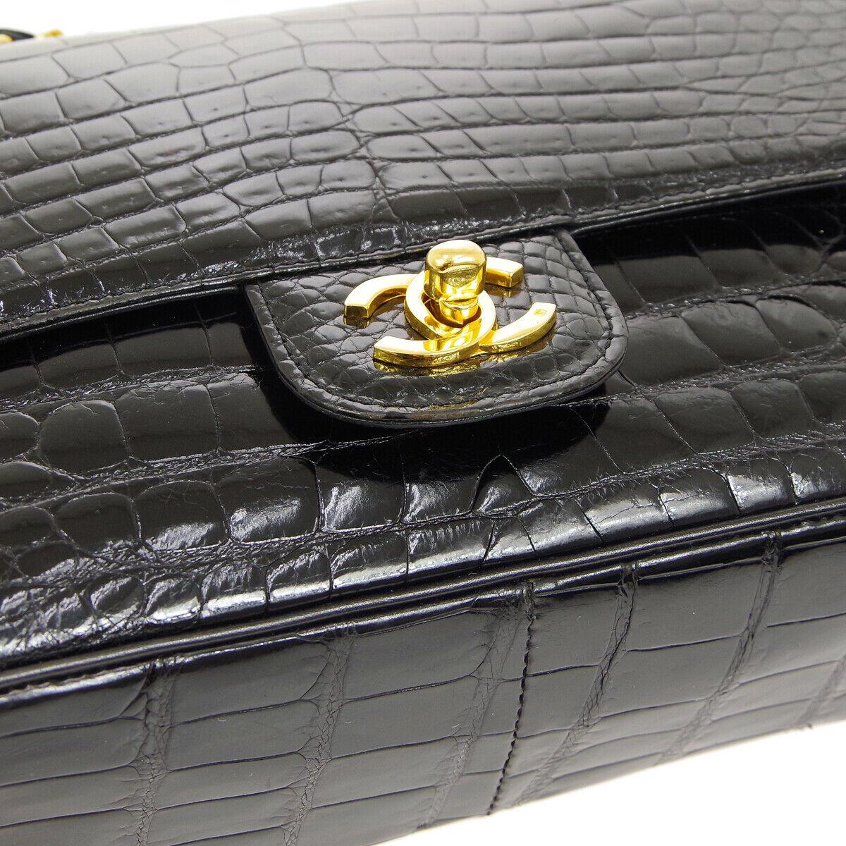 Chanel Black Crocodile Exotic Leather Gold Double Evening Shoulder Flap Bag

Crocodile
Leather
Gold tone hardware
Leather lining
Date code present
Made in France
Shoulder strap 15.5