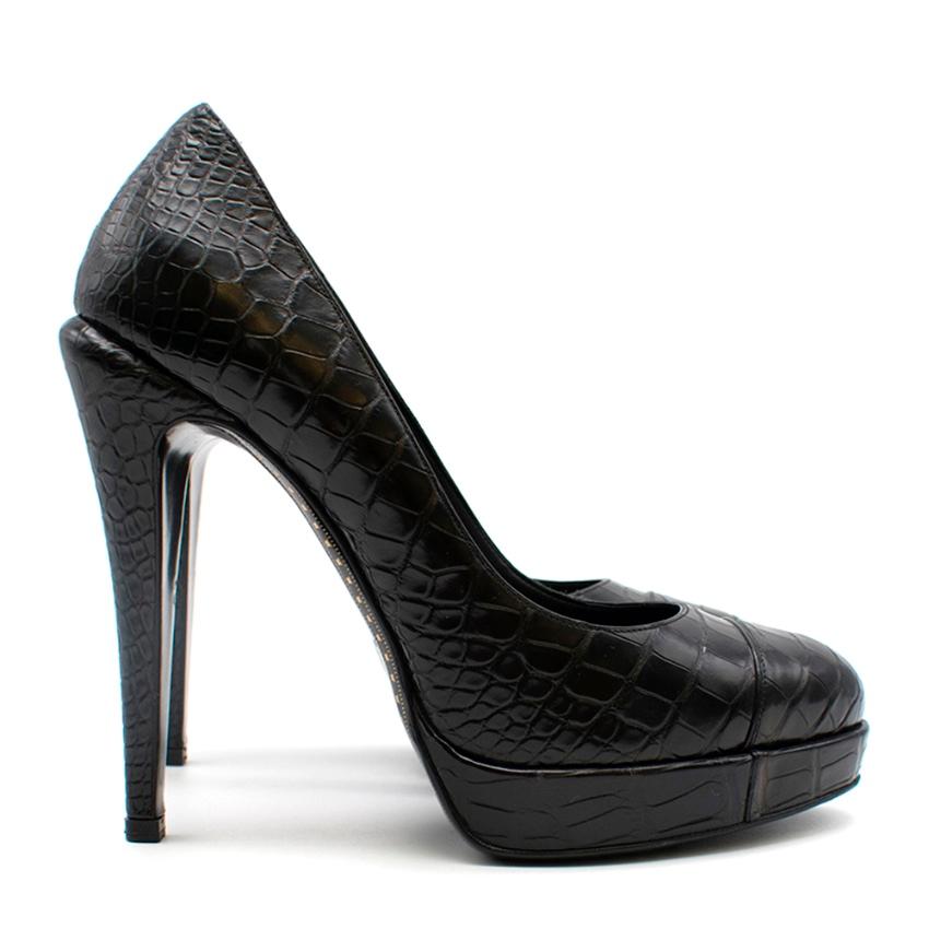 Chanel Black CC leather platform pumps. Features croc leather, platform toe, and stiletto heel. 

- Made in Italy 
- Stitched CC logo 

Please note, these items are pre-owned and may show signs of being stored even when unworn and unused. This is