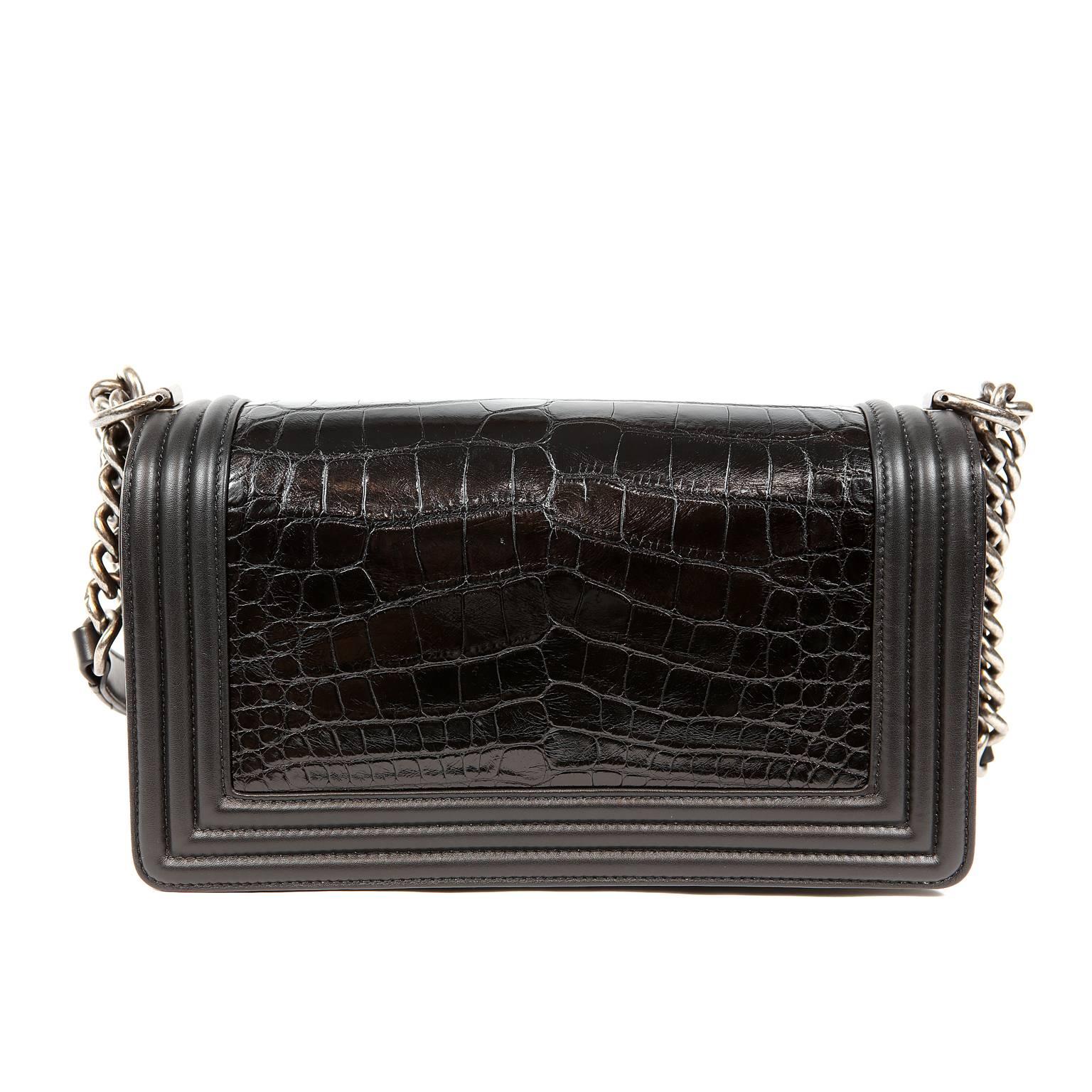 Chanel Black Crocodile Boy Bag- PRISTINE; appears never carried
The updated design is structured and edgy with a versatility that makes it extremely popular.  The exotic versions are extremely rare and considered highly collectible.
Black crocodile