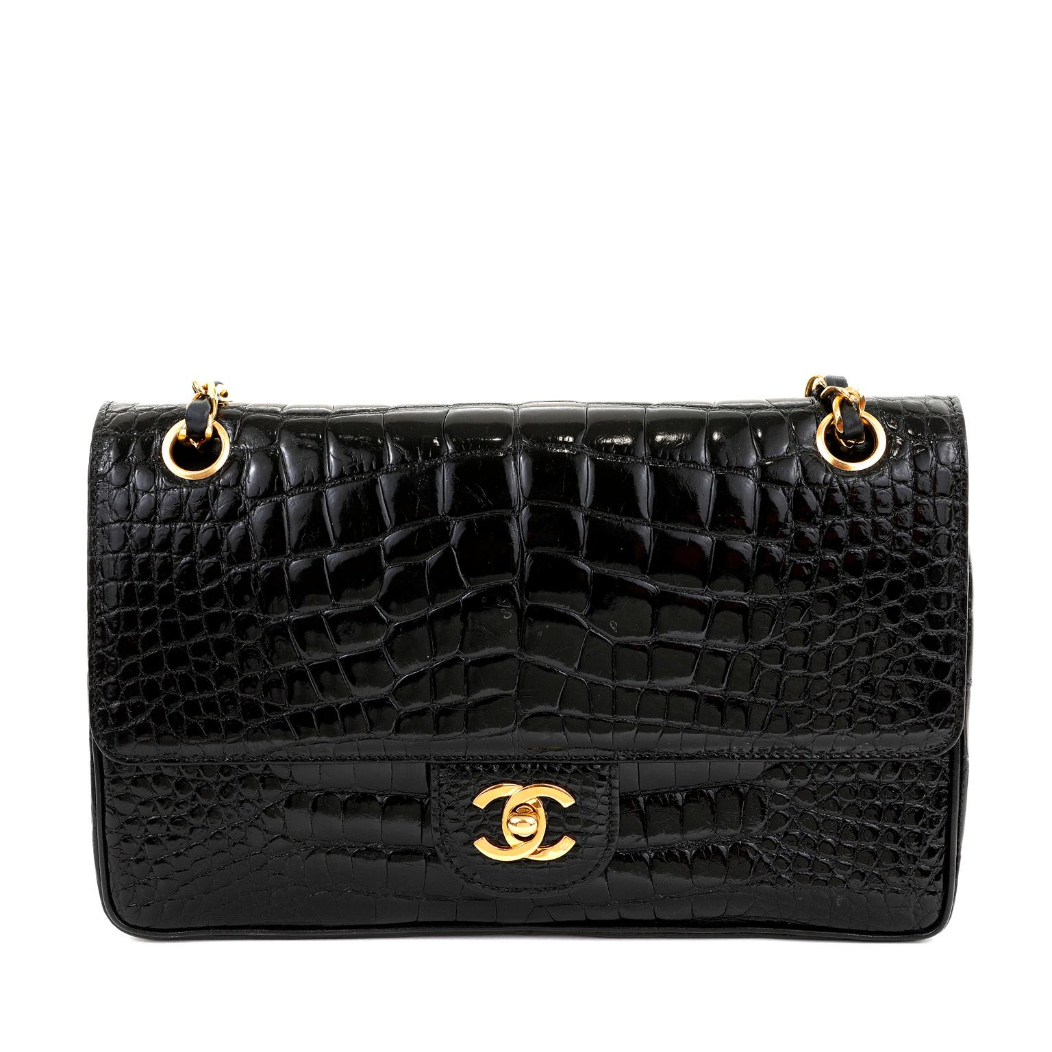 This authentic Chanel Black Crocodile Medium Classic Flap is in pristine condition.  No longer producing exotics, Chanel's remarkable crocodile Classic is extremely rare and collectible. 

Sleek black crocodile skin with gold tone interlocking CC
