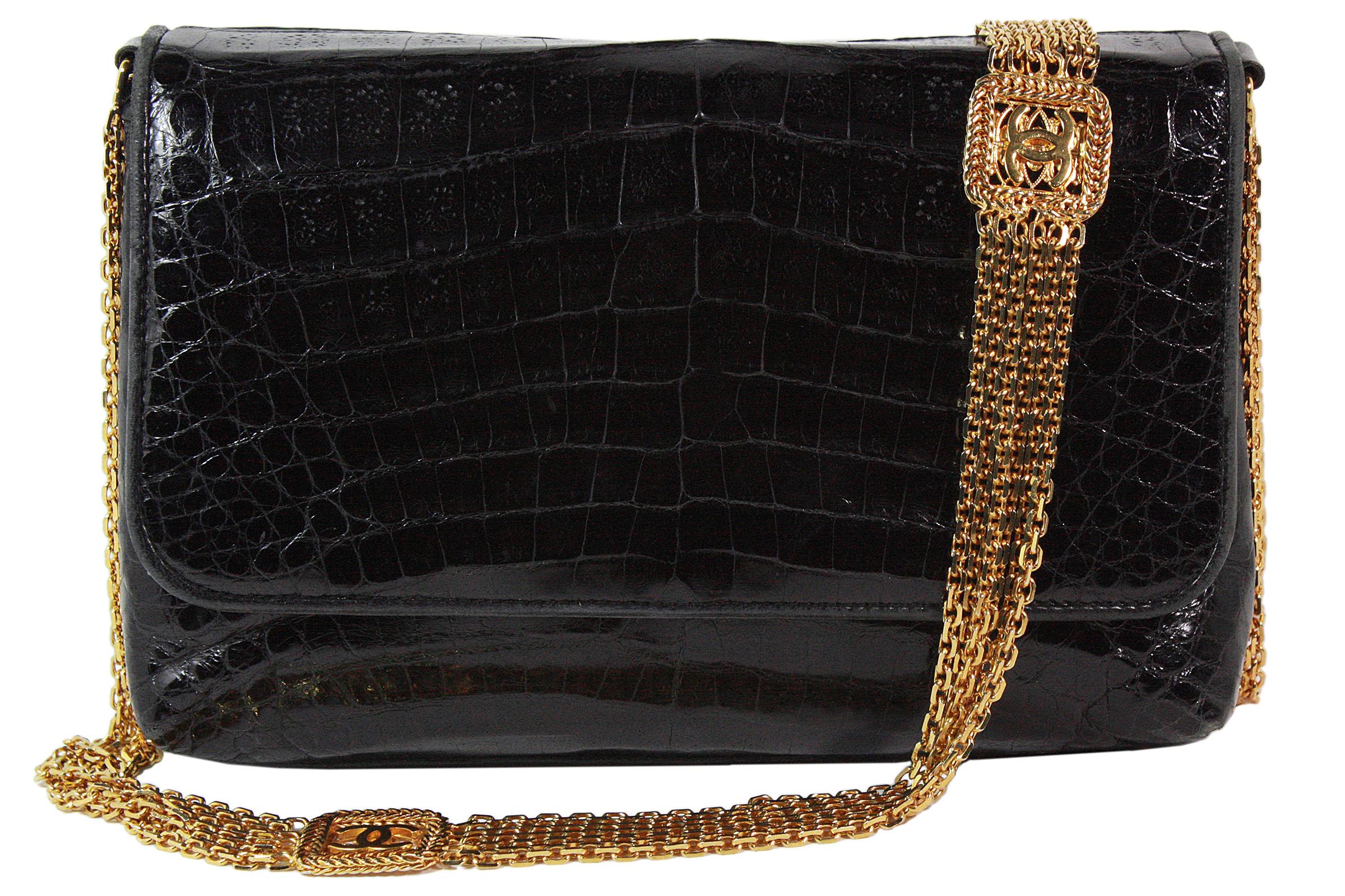 Chanel shoulder bag
Made in Italy
Black crocodile leather 
Gold multi-strand chain strap with gold CC logos 
Strap length: 36 inches 
Soft black leather lining 
Interior zippered pocket
Comes with dustbag
Authenticity card with serial number: 0420683