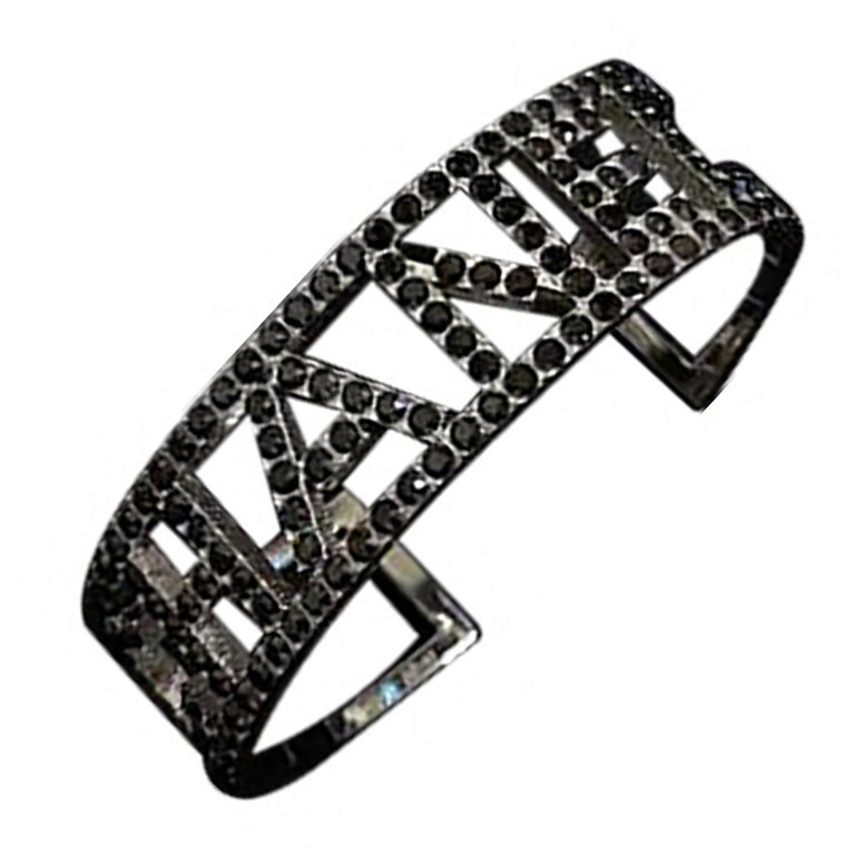 Chanel Black Crystal "CHANEL" Cuff Bracelet For Sale