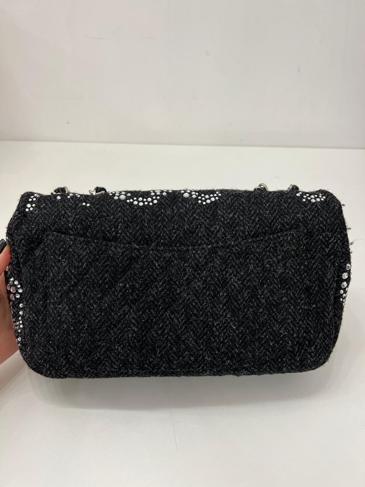 Chanel CC Flap Bag Crystal Embellished Tweed Jumbo.

Excellent condition. All stones intact.Comes with dust bag only.
