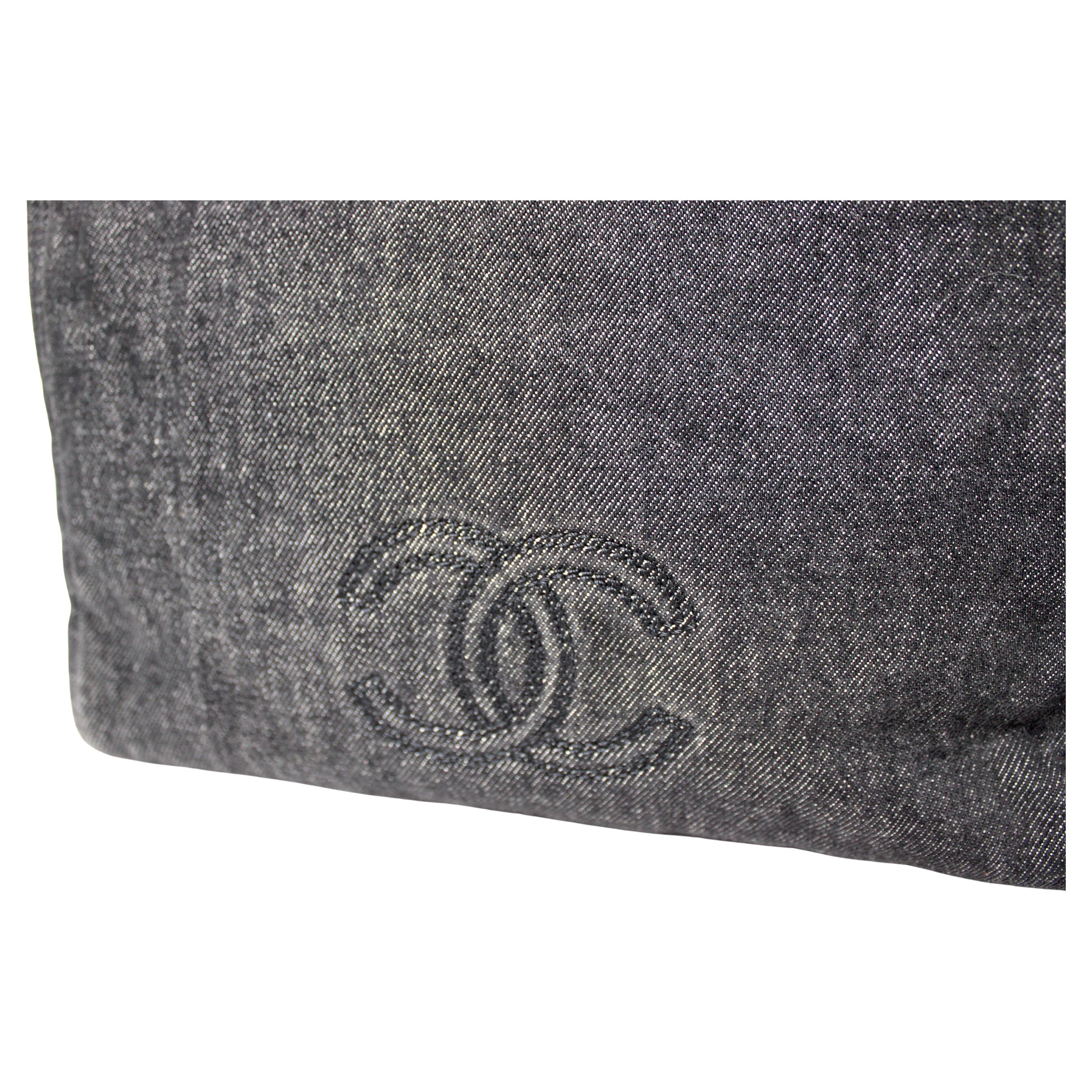 The Chanel Black Denim Coco Mark Tote Bag circa Y2K is a stylish and iconic accessory that blends casual chic with luxury craftsmanship. Crafted from durable black denim, this tote exudes a vintage yet timeless appeal, perfect for adding a touch of