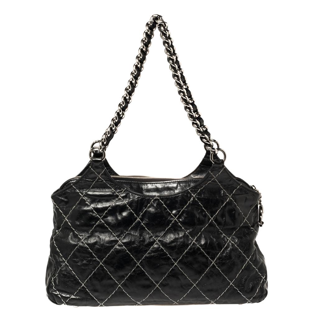 Famous for its excellent designs, this handbag from Chanel is just what you need. This super stylish bag will catch your fancy almost instantly. Crafted from leather in a black shade, it features signature quilt stitches and dual handles.

Includes: