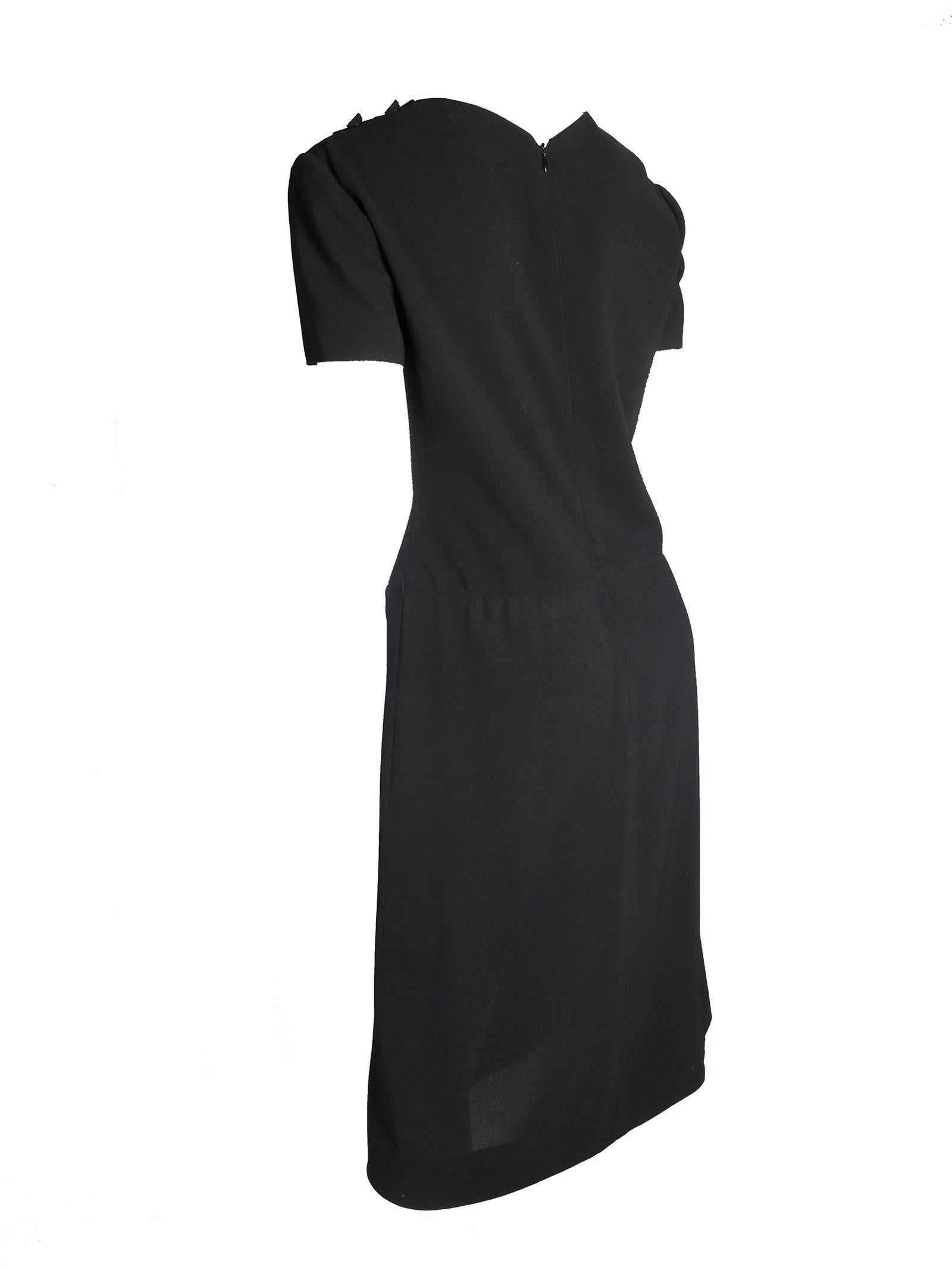 1999 Chanel black wool dress with diagonal wool trim, single patch pocket.  Condition: good, small hole by waist on side , missing belt. Size 40
 
We accept returns for refund, please see our terms.  We offer free ground shipping within the US.