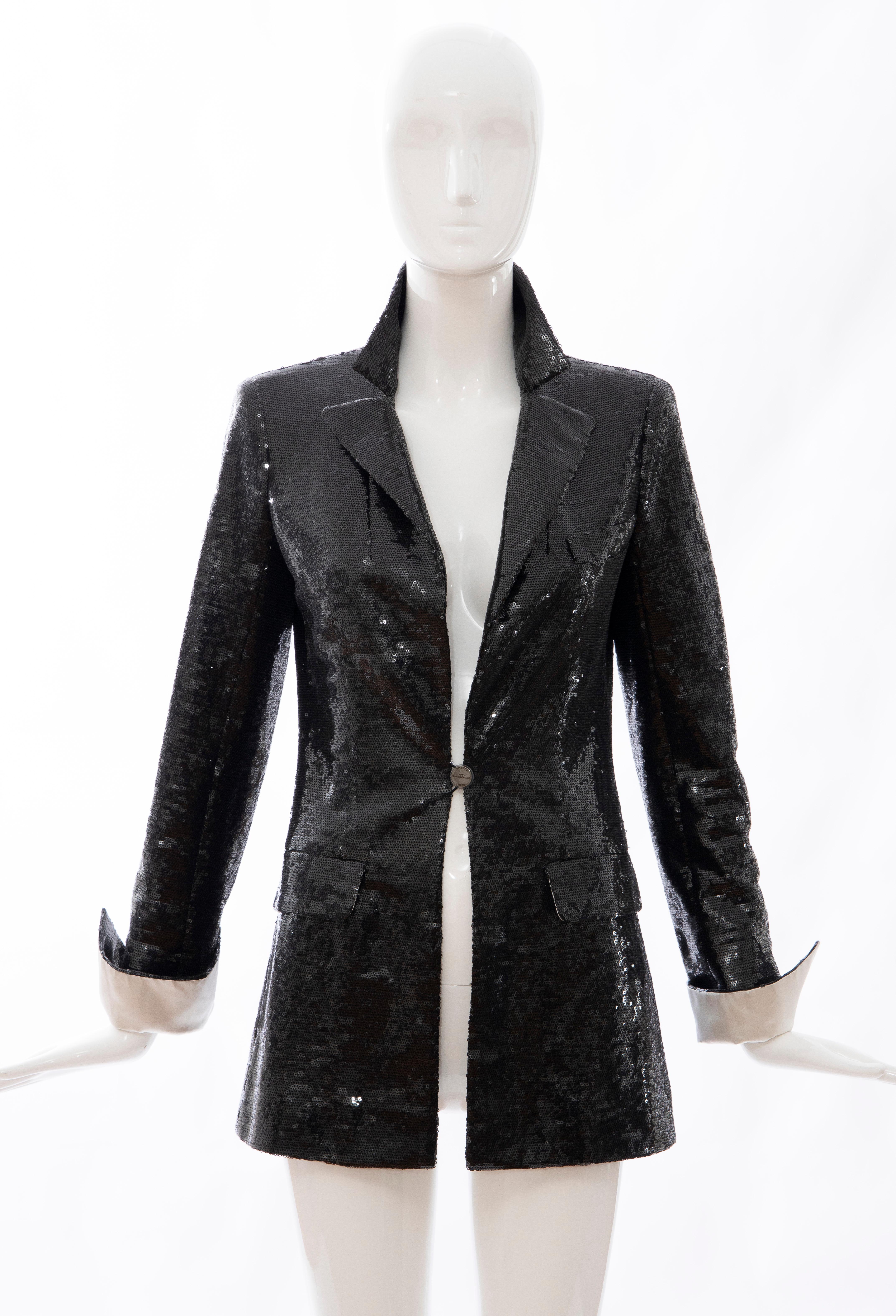 Chanel, Cruise 2009, black embroidered sequin evening jacket with two front flap pockets, ivory silk trim at cuffs. single front button closure, signature interior chain and fully lined in black silk.

EU. 36, US. 4

Bust 33, Waist 31, Shoulder: 15,
