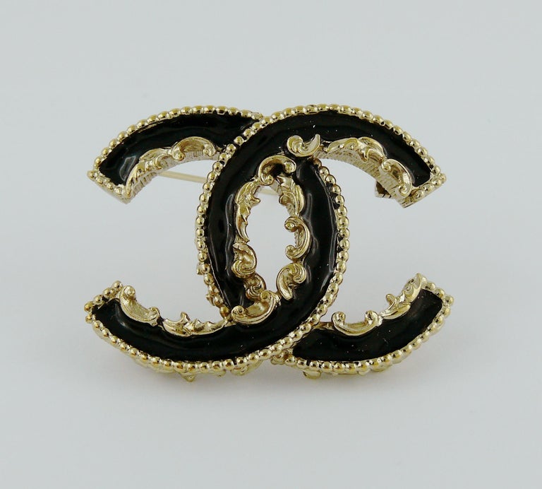 Chanel Black Enamel Baroque Logo Brooch at 1stDibs