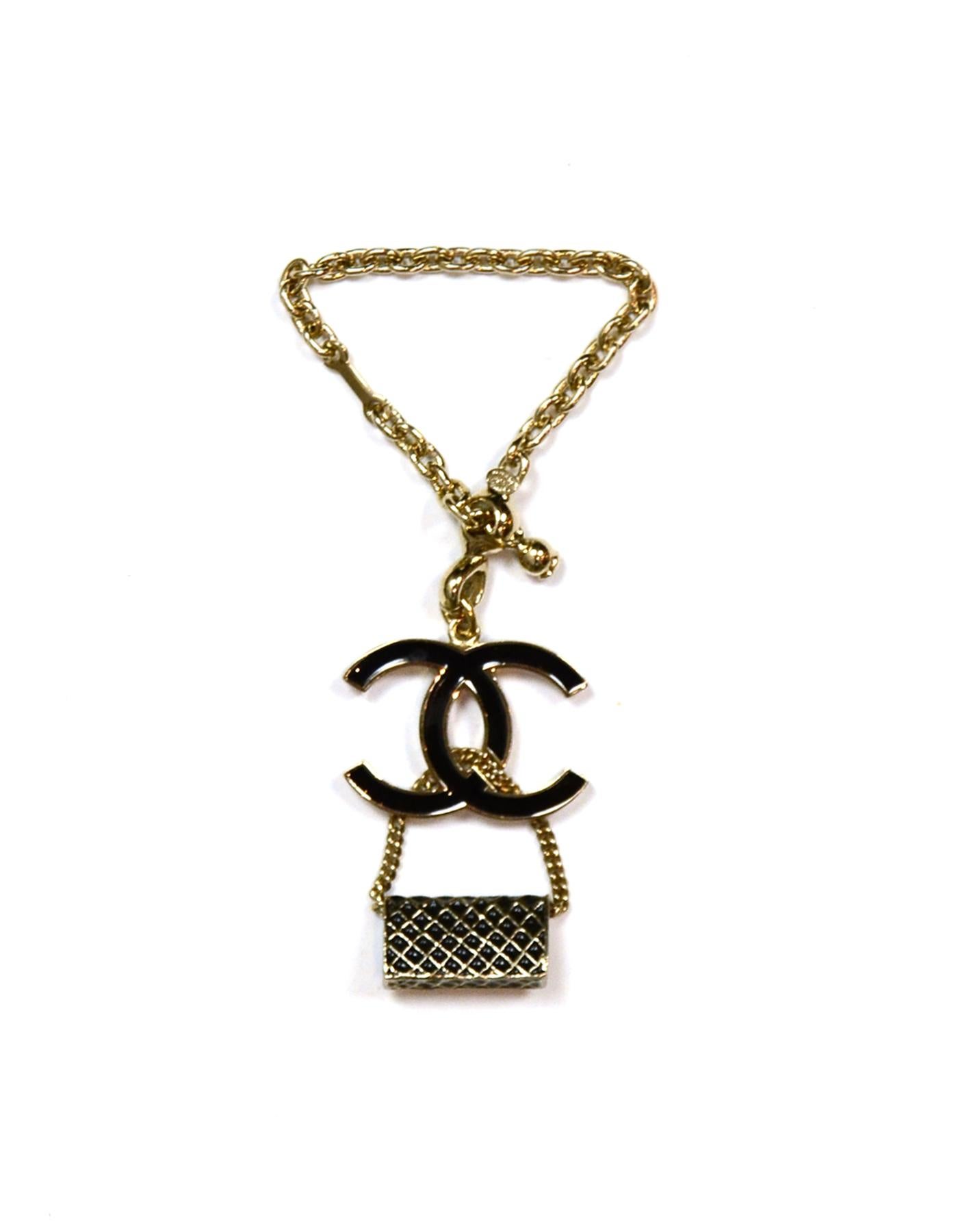 Chanel Black Enamel Goldtone CC & Flap Bag Keychain Bag Charm

Made In: Italy
Year of Production: 2007
Color: Light goldtone, Black
Materials: Enamel, Metal
Hallmarks: 