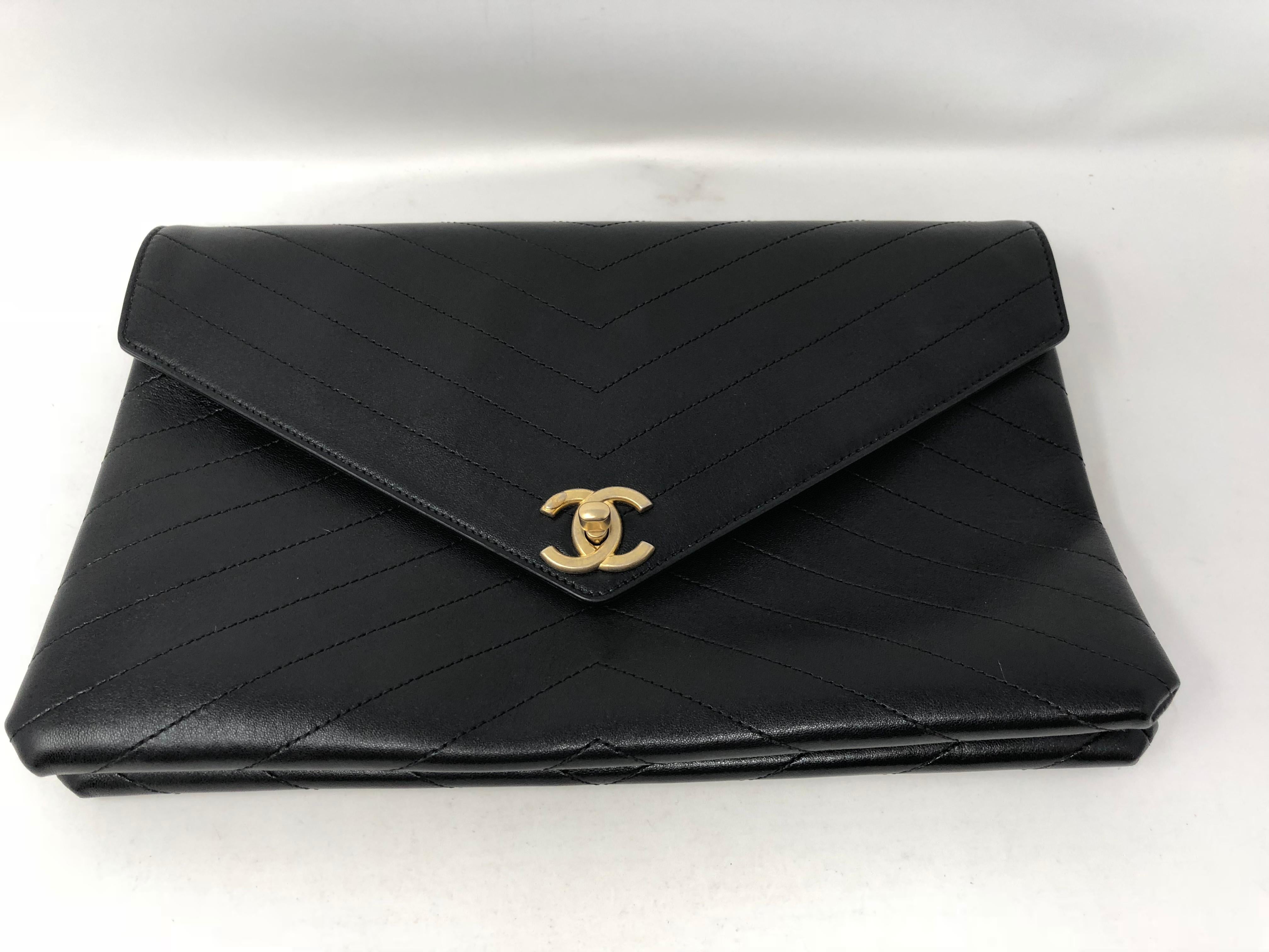 Chanel Black Envelope Clutch in Chevron pattern with gold hardware. Bigger size clutch to hold all your essentials. A classic piece to add to your collection. Excellent condition. Guaranteed authentic. 
