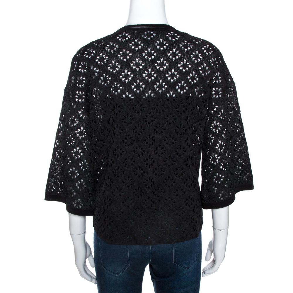 Chanel is known for its sophisticated design aesthetic and fine craftsmanship. This cardigan is no different. Crafted from quality silk, this creation comes in a black hue. it has a simple silhouette and is styled with eyelet patterns, relaxed