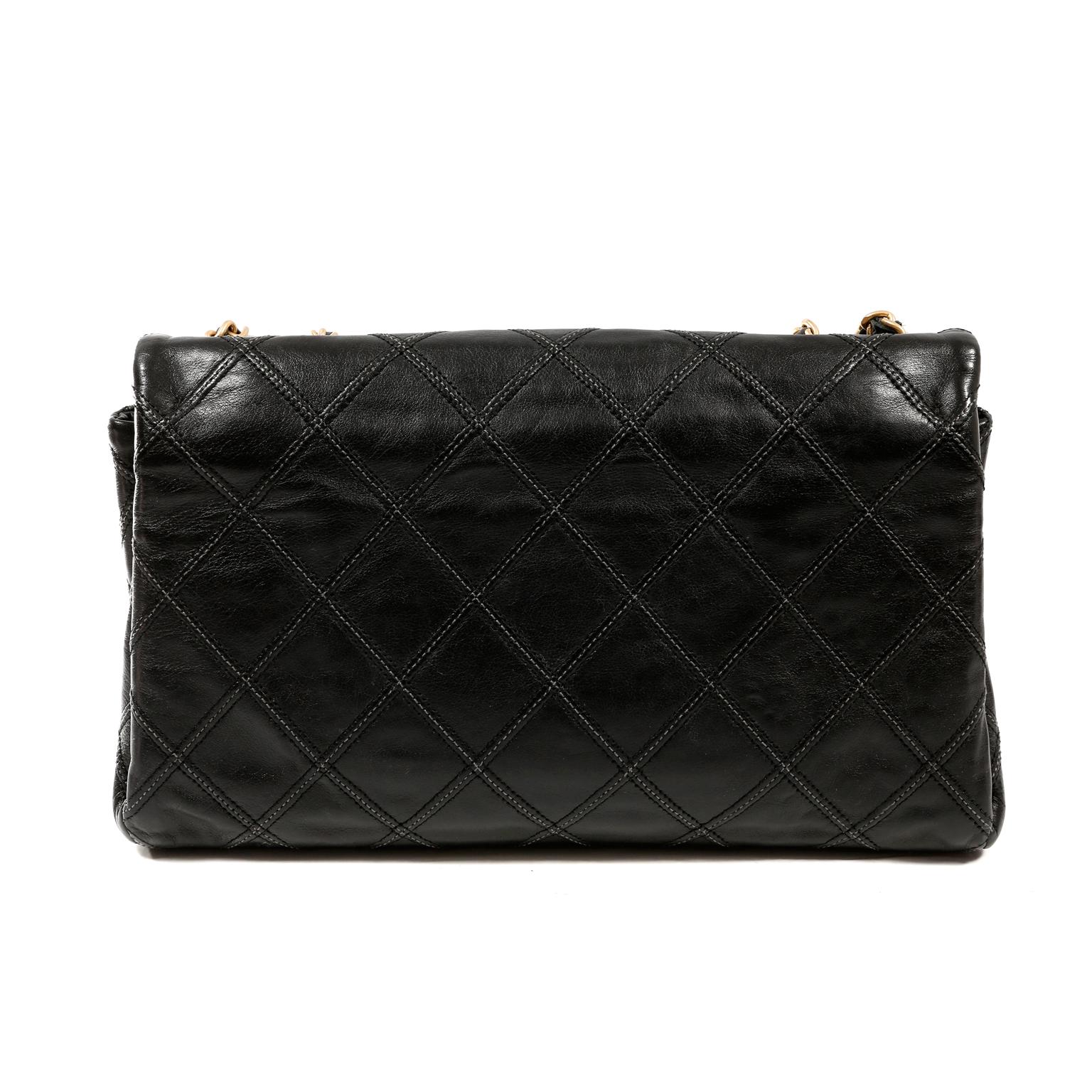 This authentic Chanel Black Flat Stitched Leather Flap Bag is in very good condition.  A variation of the Classic Flap, this versatile medium sized bag has flat stitching and a three-compartment interior.  
Large gold tone interlocking CC twist lock