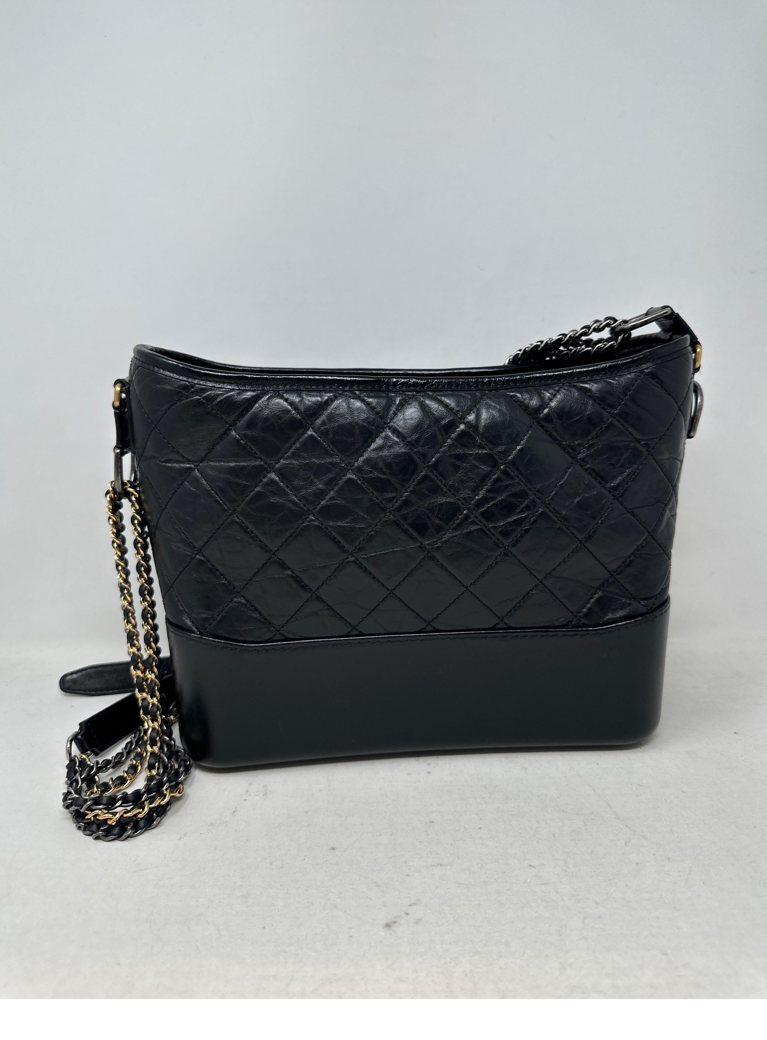 Chanel Black Gabrielle Medium Bag. Multi-functional ways to wear this classic bag. Two-tone gold and silver hardware makes it easy to wear with different outfits. Very good condition. Leather looks great. Nice casual and understated look. Interior