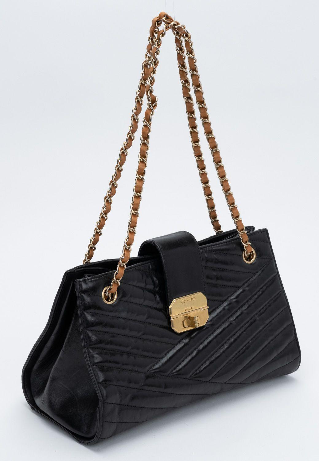 Black Chanel Gabrielle tote with brown leather straps. Satin finish gold hardware. Shoulder drop 11/20