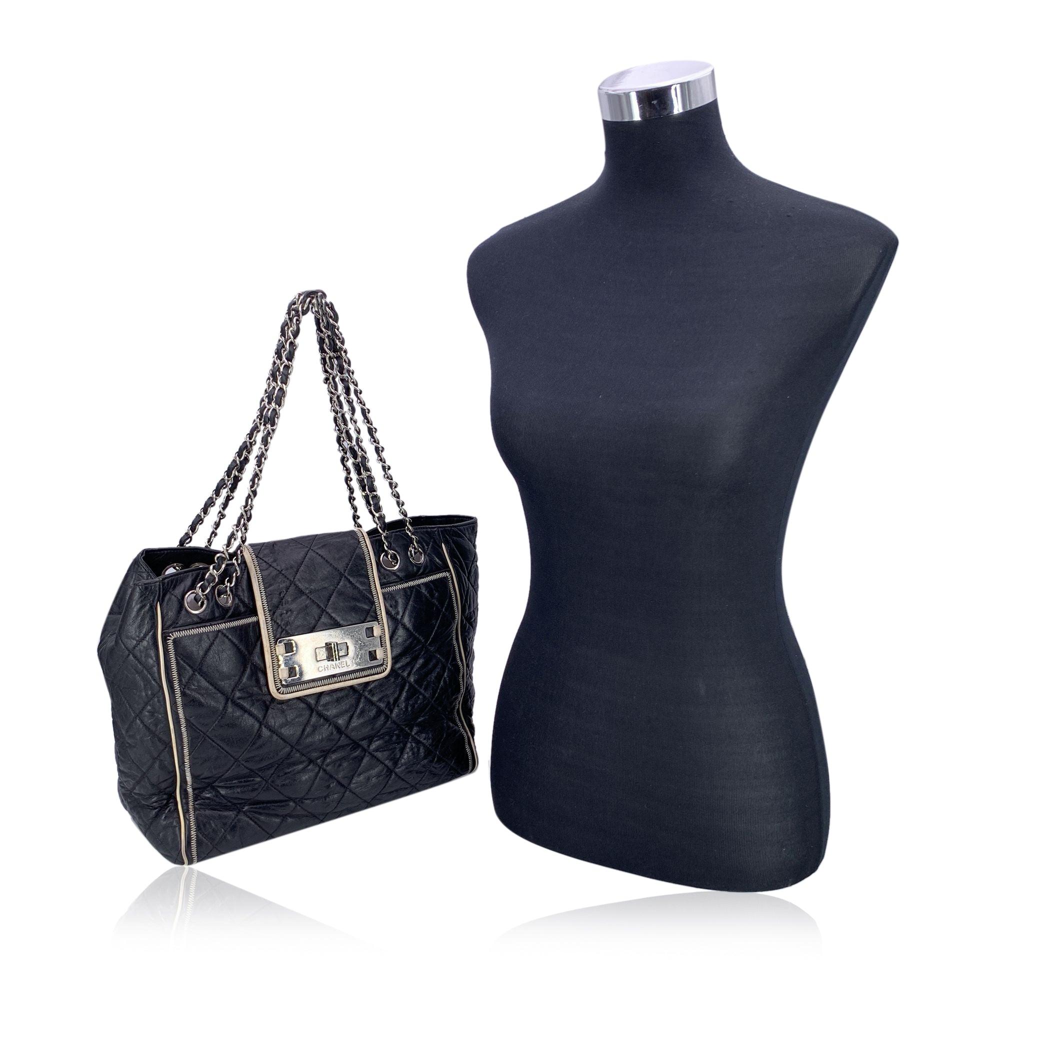 This beautiful Bag will come with a Certificate of Authenticity provided by Entrupy. The certificate will be provided at no further cost Step into the world of timeless elegance with this authentic CHANEL Glazed Lambskin Quilted Large North South
