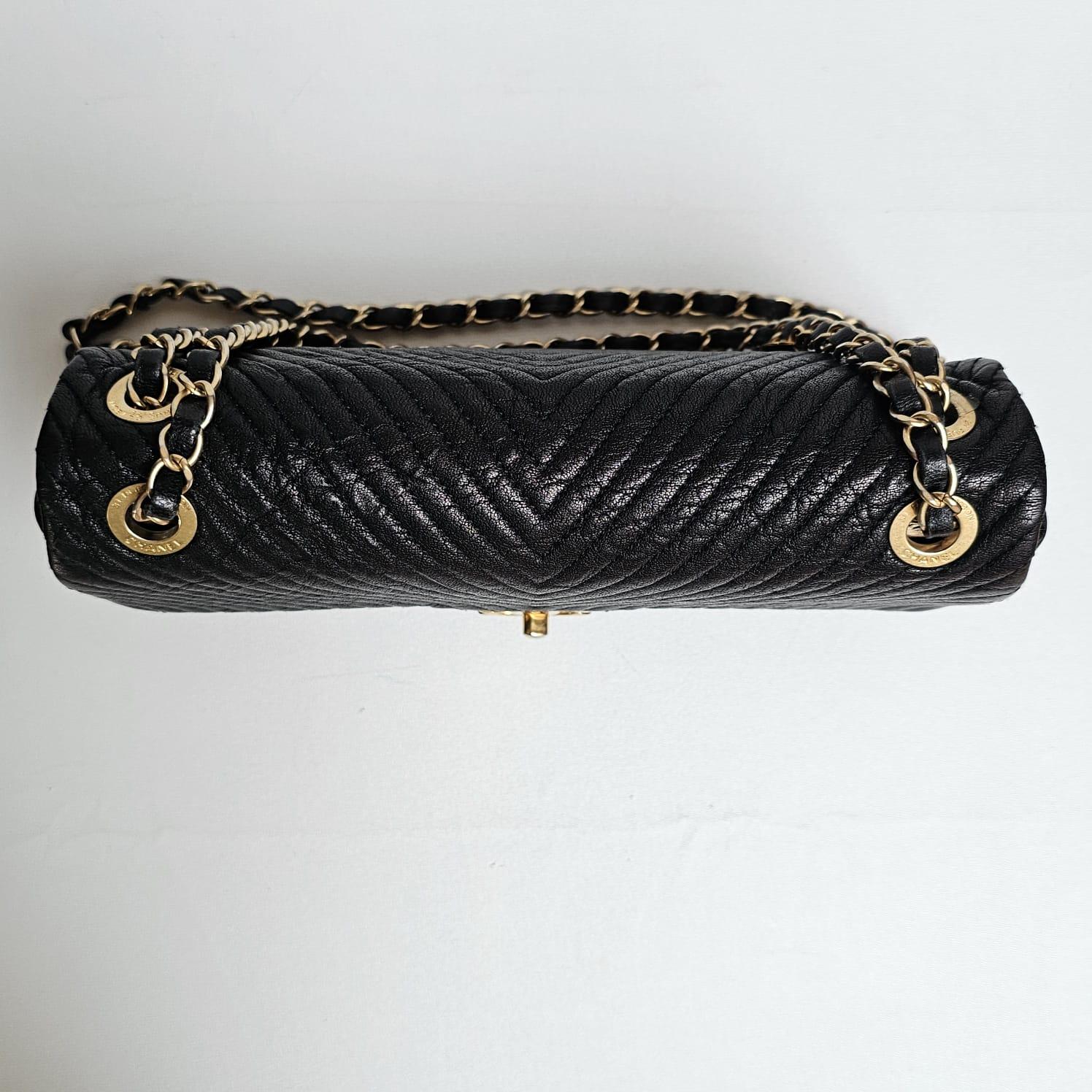 Classic chanel chevron flap bag in black goatskin leather. Slight distressed like leather, light and not easily scratched. Slight wrinkling on the body of the leather due to storage. Faint scuffing on the hardware turn lock due to wear. Overall in