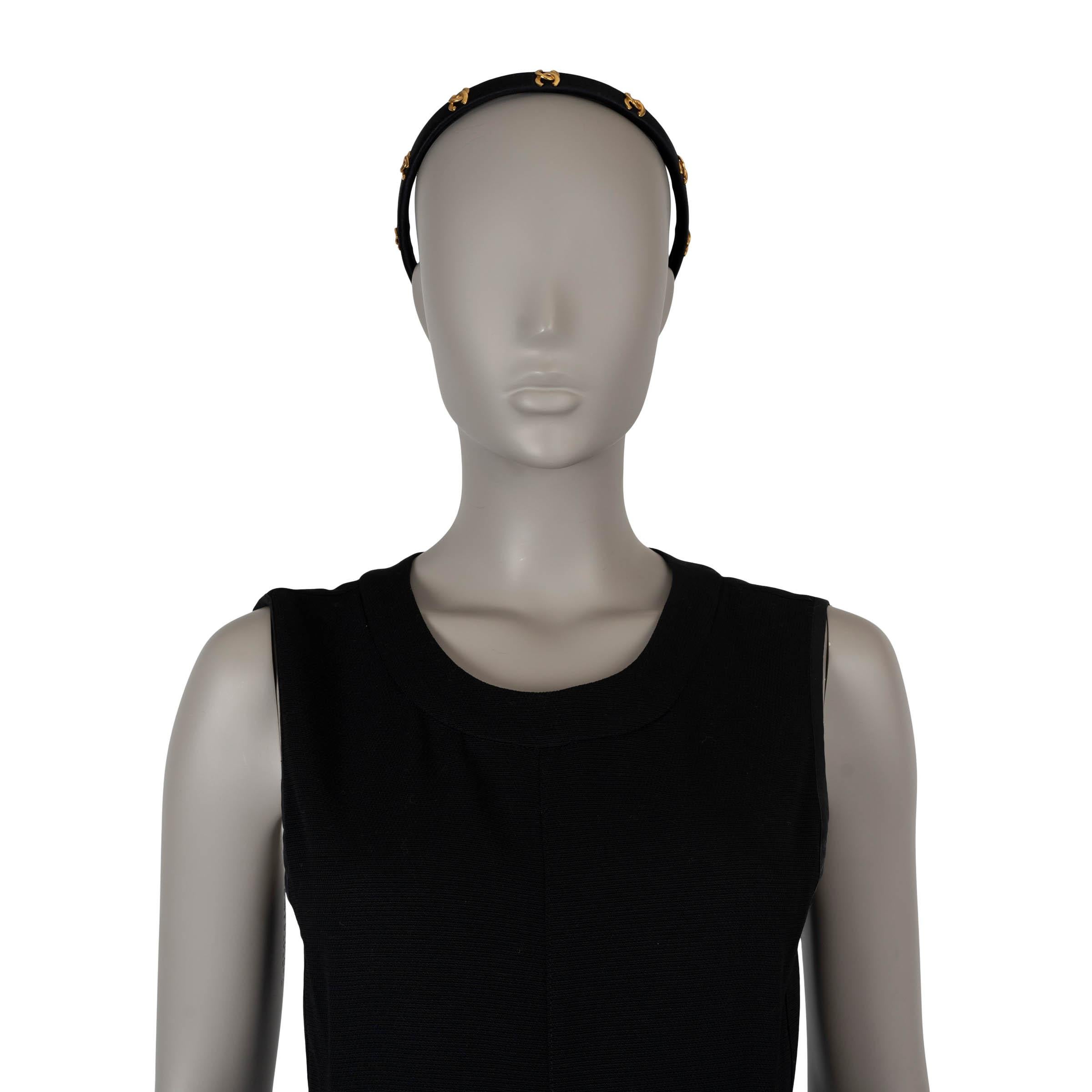 This 100% authentic Chanel vintage headband is crafted from black satin and features a chic, minimalist design. Embellished with seven gold-tone CC logos, it embodies Chanel’s signature elegance. The thin, sleek structure of the headband adds a