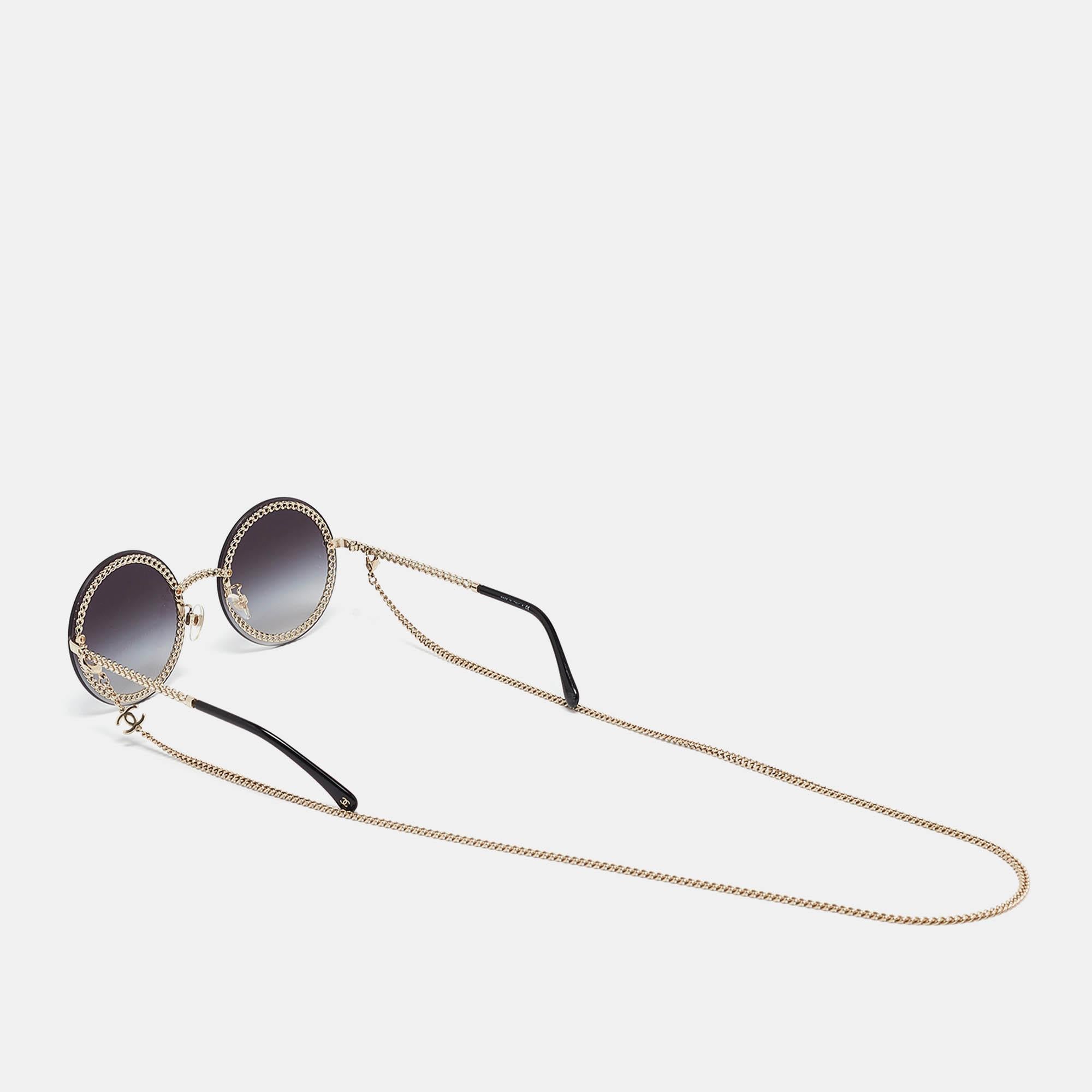 This pair of Chanel sunglasses is an ideal pick for a day out in the sun or indoor photoshoots. It's a statement accessory.  The round frame is beautified with chain accents, 