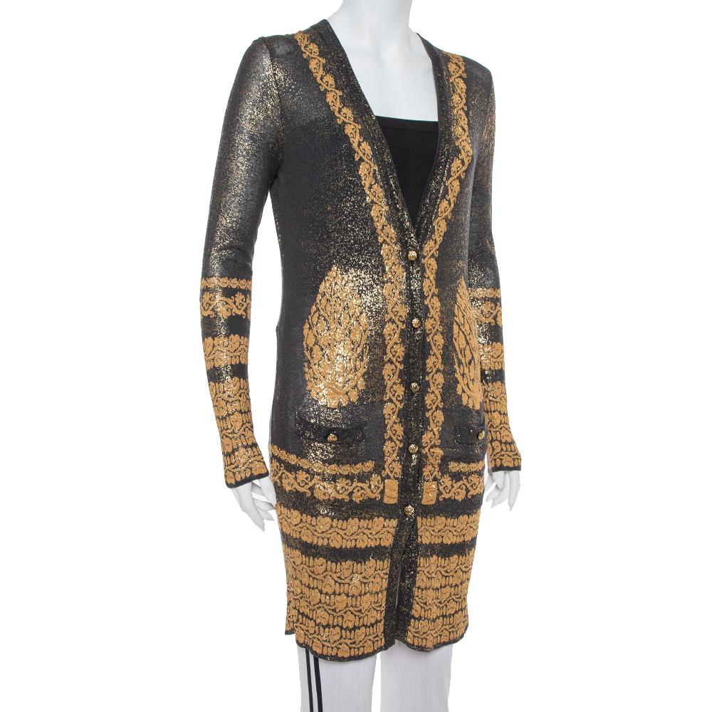 Ace a statement look when you wear this Chanel cardigan to your next outing. The creation features black and gold shades, intricate embroidery, and a front button fastening. Style it over short dresses or turtle neck sweaters for a chic look.

