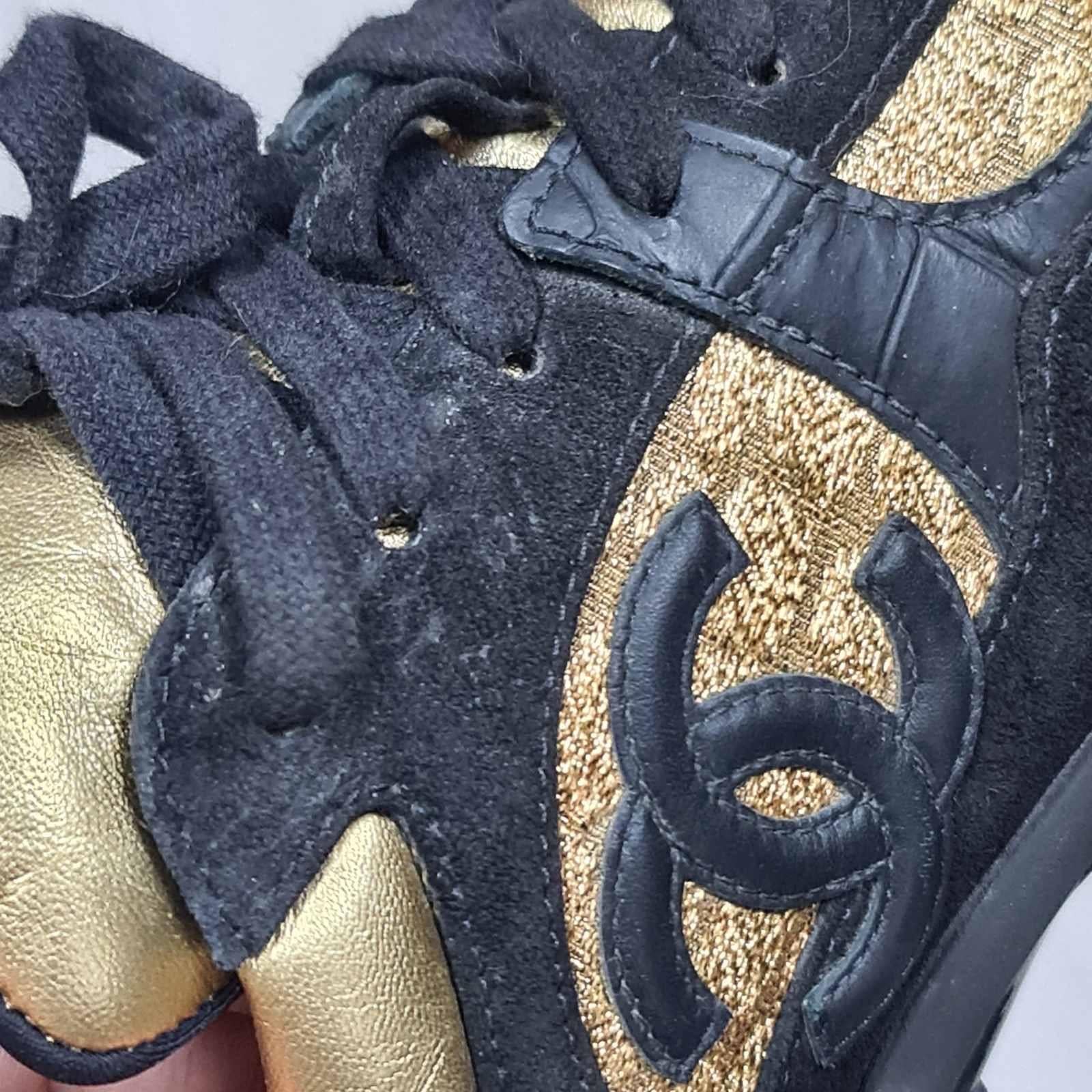Women's Chanel Black/Gold Suede and Leather CC Low Top Sneakers  For Sale
