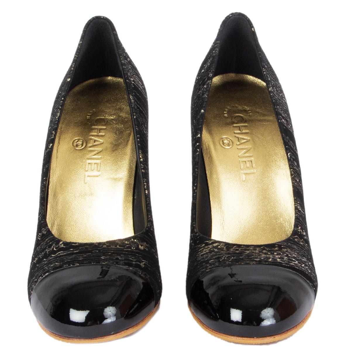 100% authentic Chanel pumps in black and gold textured suede with a black patent leather cap. Featuring embellished off-white faux pearl heel with gold-toe hardware. Brand new. Rubber soles have been added. Come with dust bag. 

Imprinted