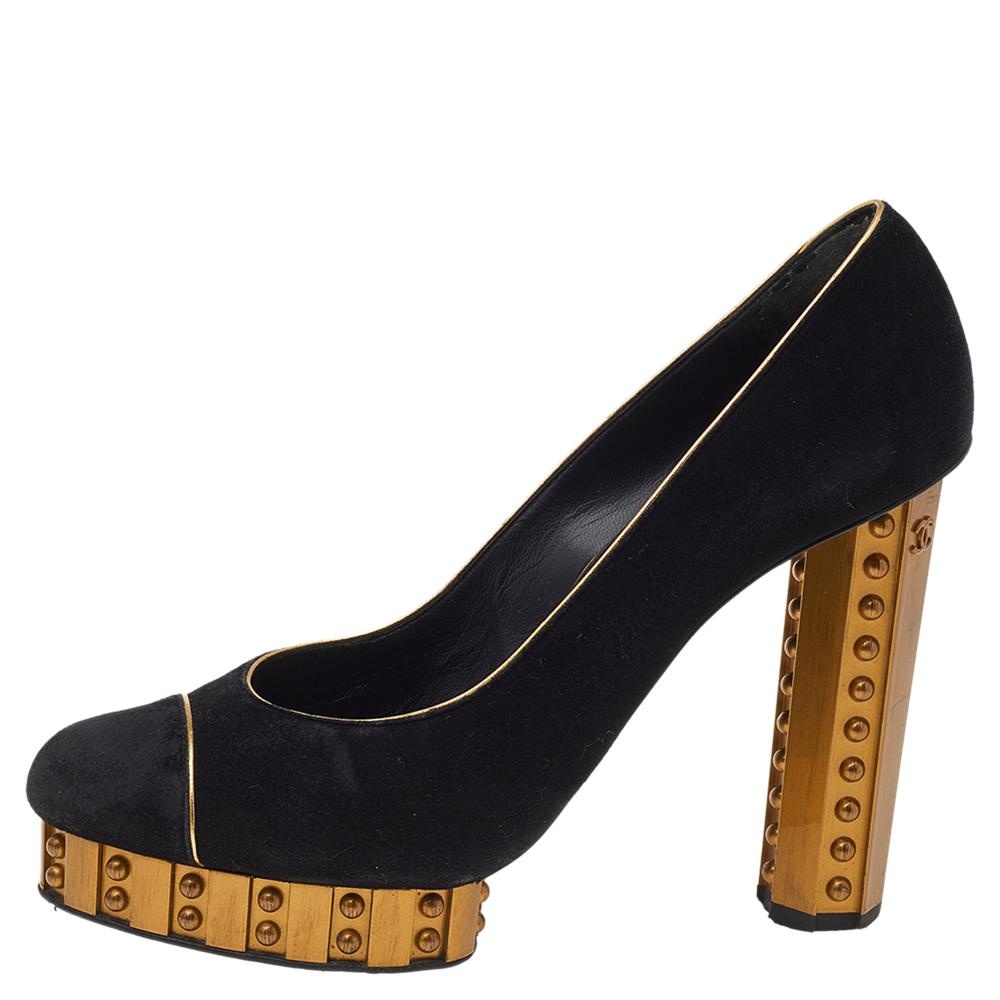 Render your feet with nonpareil style as you wear these Chanel pumps. They are exquisitely crafted using gold-black suede on the upper and flaunt peep-toes, platforms, and block heels. As you wear these to a party, you will fetch nothing but praise.