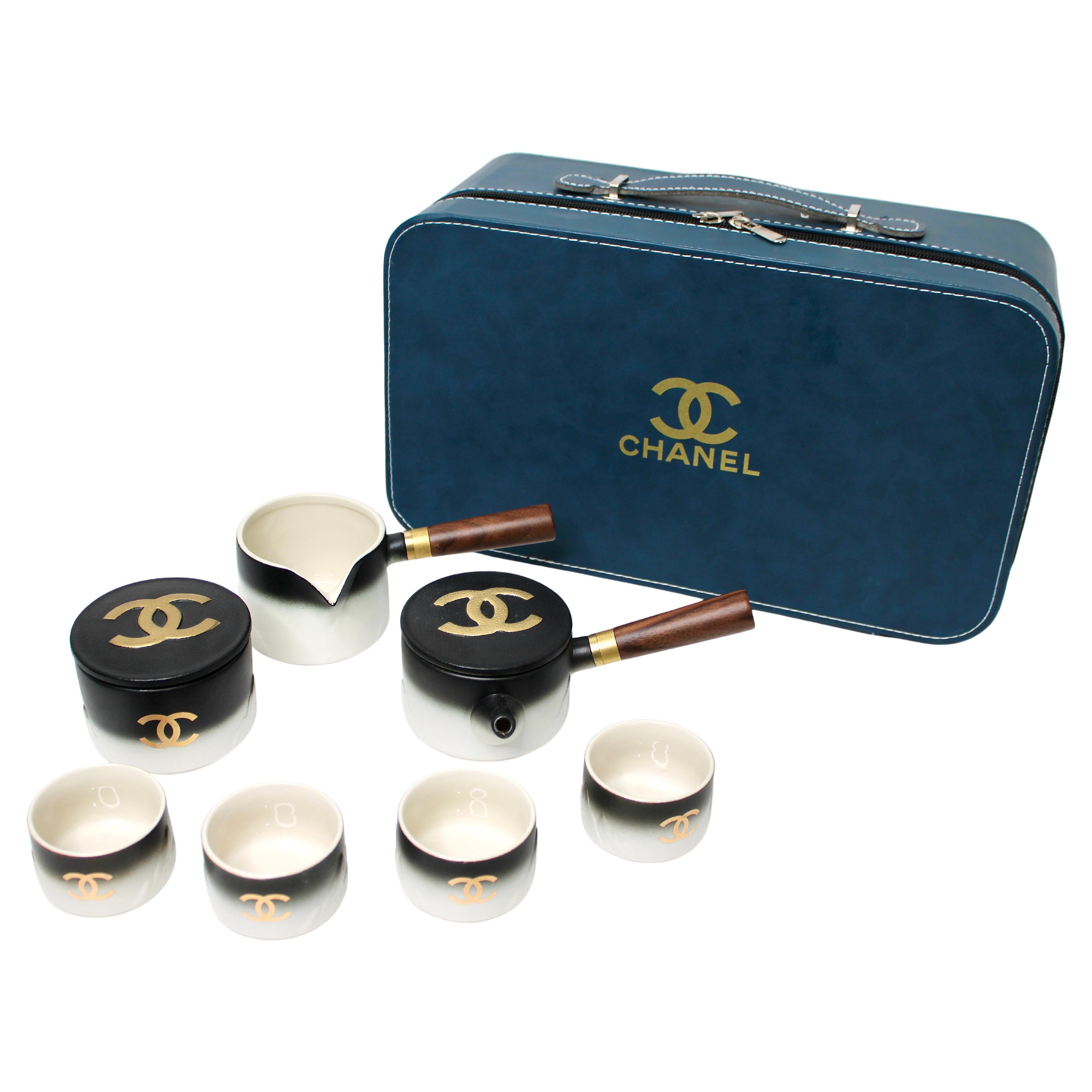 Chanel Black 
Gold-Tone Porcelain Coffee 
Tea Set