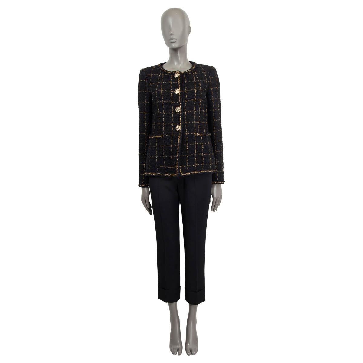 100% authentic Chanel Fall/Winter 2016 single breasted check boucle blazer in black and gold viscose (27%), nylon (26%), wool (21%), cotton (8%), acrylic (8%), mohair (8%) and polyester (2%). Features two slit pockets on the front and 'CC' buttoned