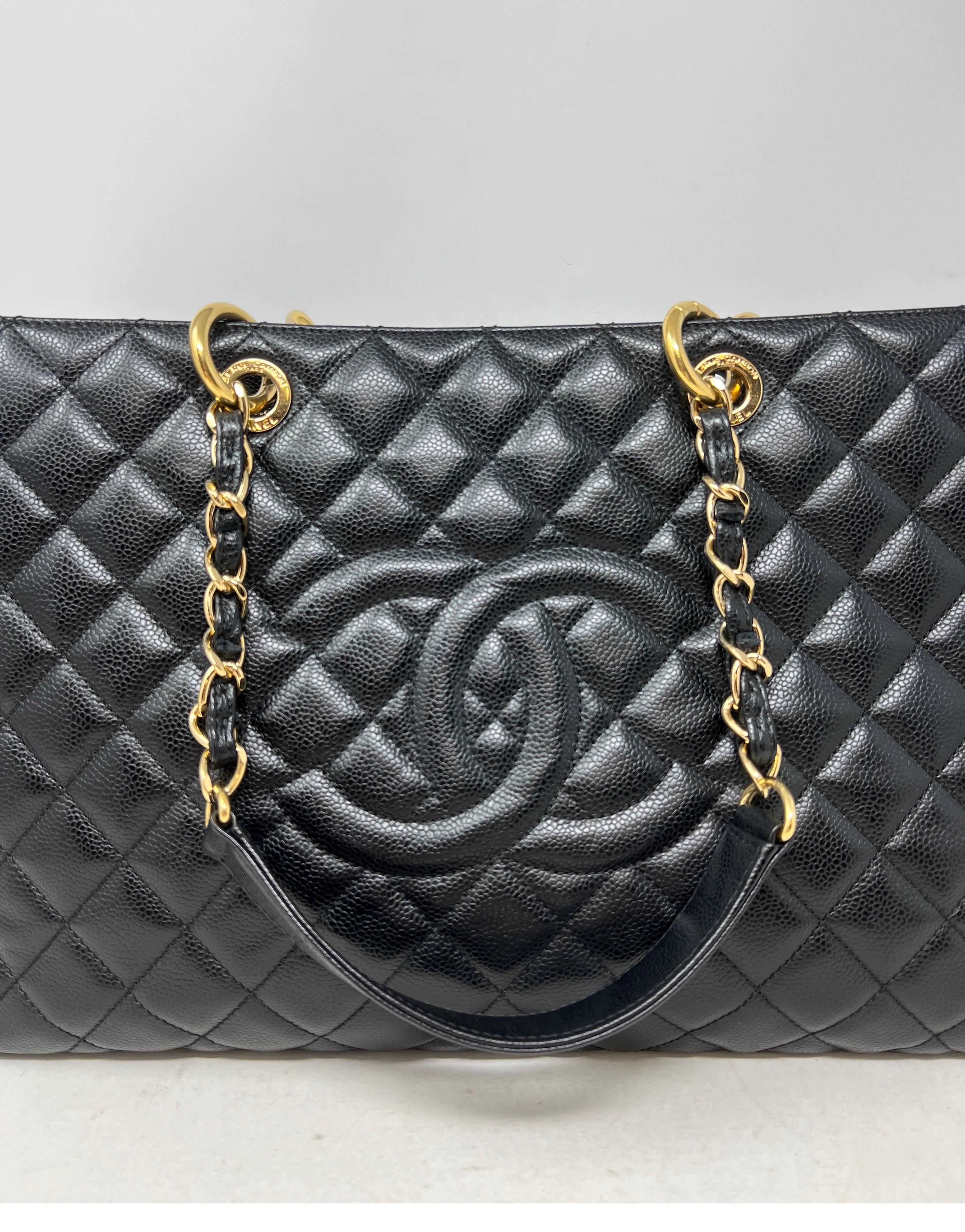 Chanel Black Grand Shopper Tote. Gold hardware. Caviar leather. Excellent condition. Looks like new. Interior clean. Retired from Chanel. This is the extra large version of the shopper totes. Guaranteed authentic. 