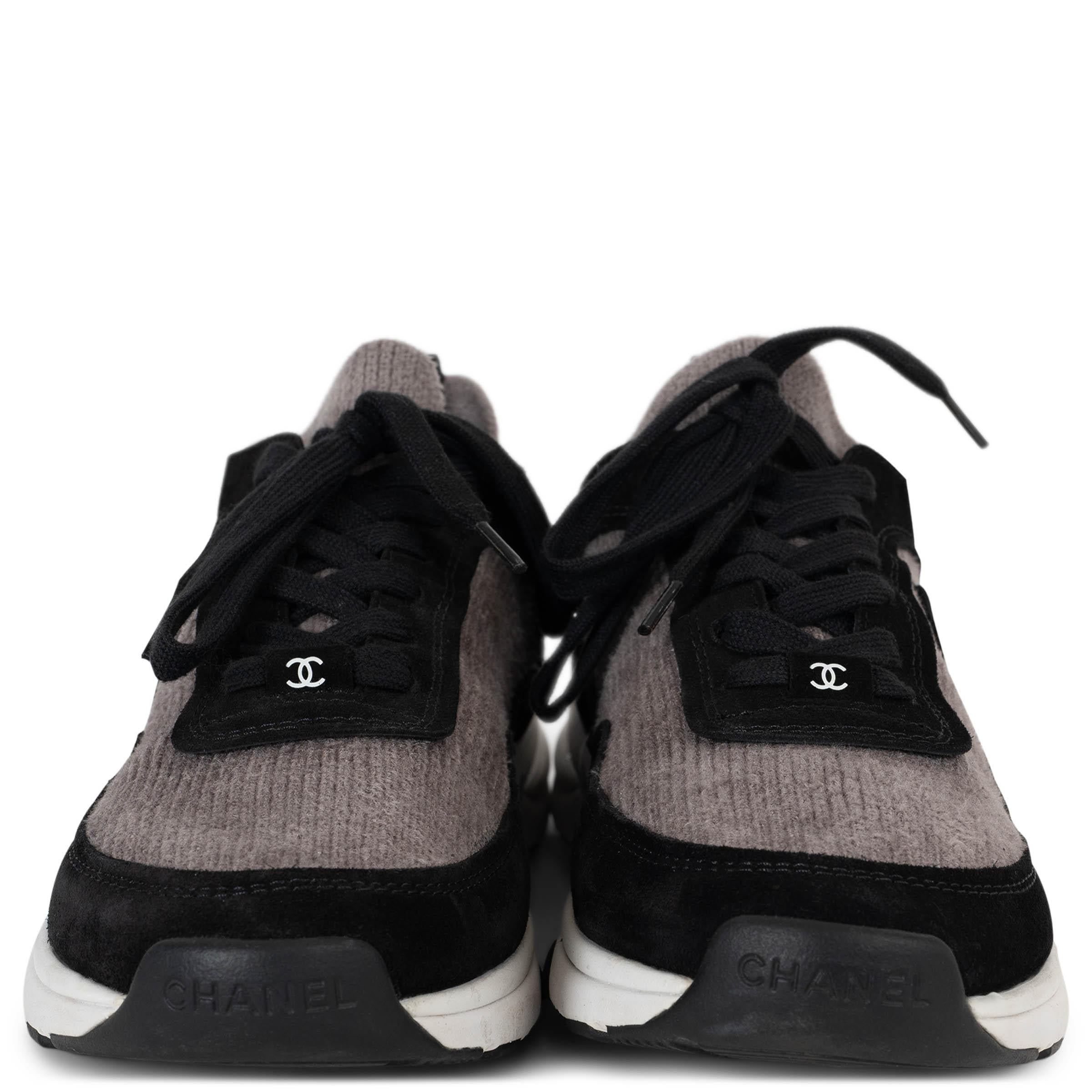 This 100% authentic Chanel low-top sneakers in taupe knit blend modern comfort with timeless elegance. Accented with black suede trims, they feature rounded toes and a suede CC on the outsides for a subtle yet iconic touch. A tonal signature on the