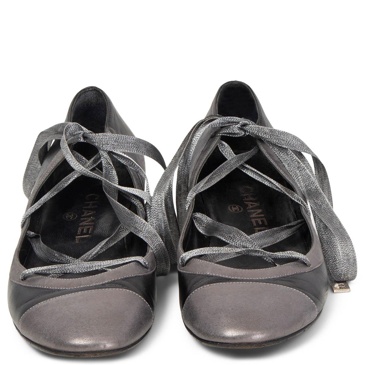 100% authentic Chanel mini kitten heel ballet flats in black and metallic grey leather with silver lurex ankle-strap lace detail. Have been worn and show wear to the soles. Overall in very good condition. Come with dust bags.