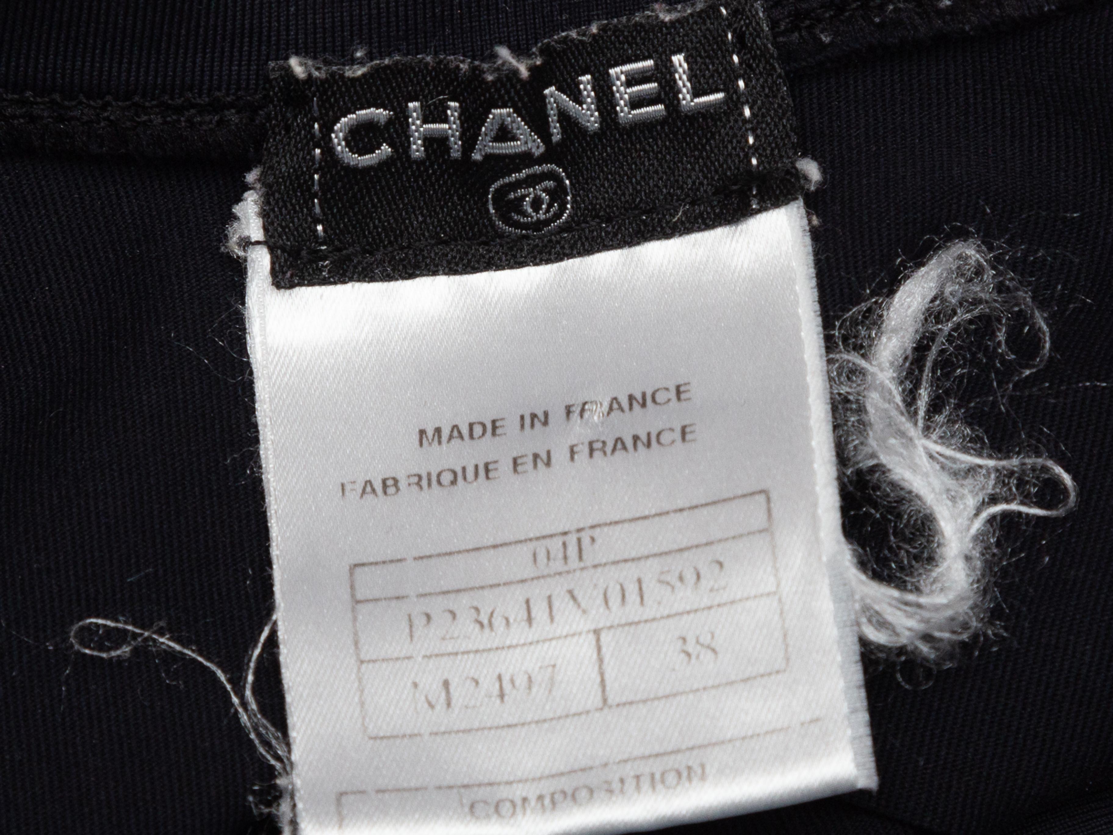 Product details: Black and grey sleeveless nylon crop top by Chanel. From the Spring 2004 Collection. Crew neck. Zip closure at bust. Designer size 38. 28