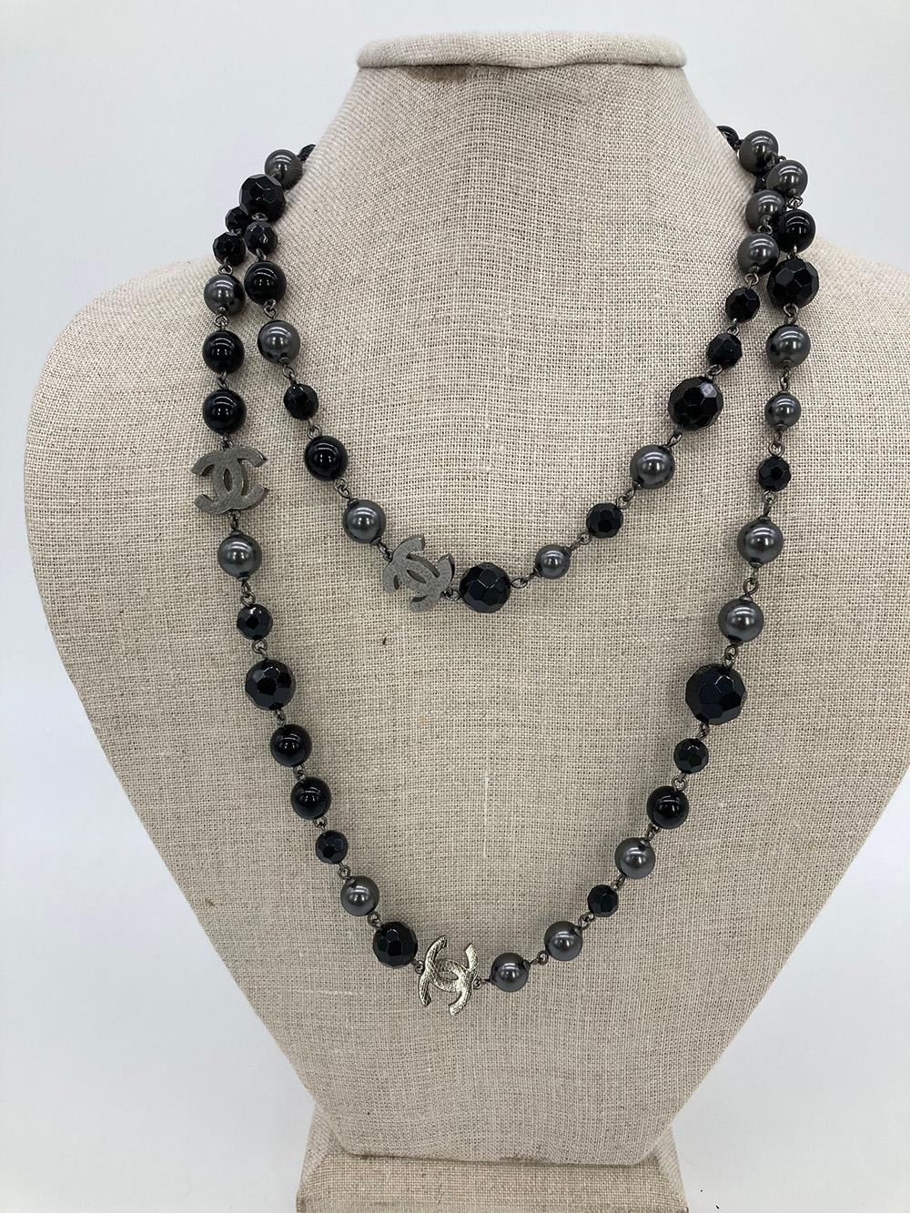 Chanel Black Beaded CC Charm Necklace in excellent condition. Black and gunmetal beads with etched gunmetal CC logos throughout. Lobster clasp closure. No chips, scuffs or stains. Measures 42