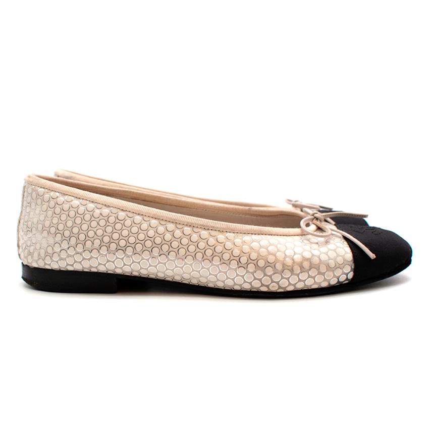 Chanel Black & Ivory Metallic Spotted Ballerina Flats

- black grosgrain toe
- Sequinned spotted pattern 
- Chanel CC logo to the front 
- Padded leather insoles for extra comfort 
- Elasticated sides for practicality 
- Rubber trim for a great