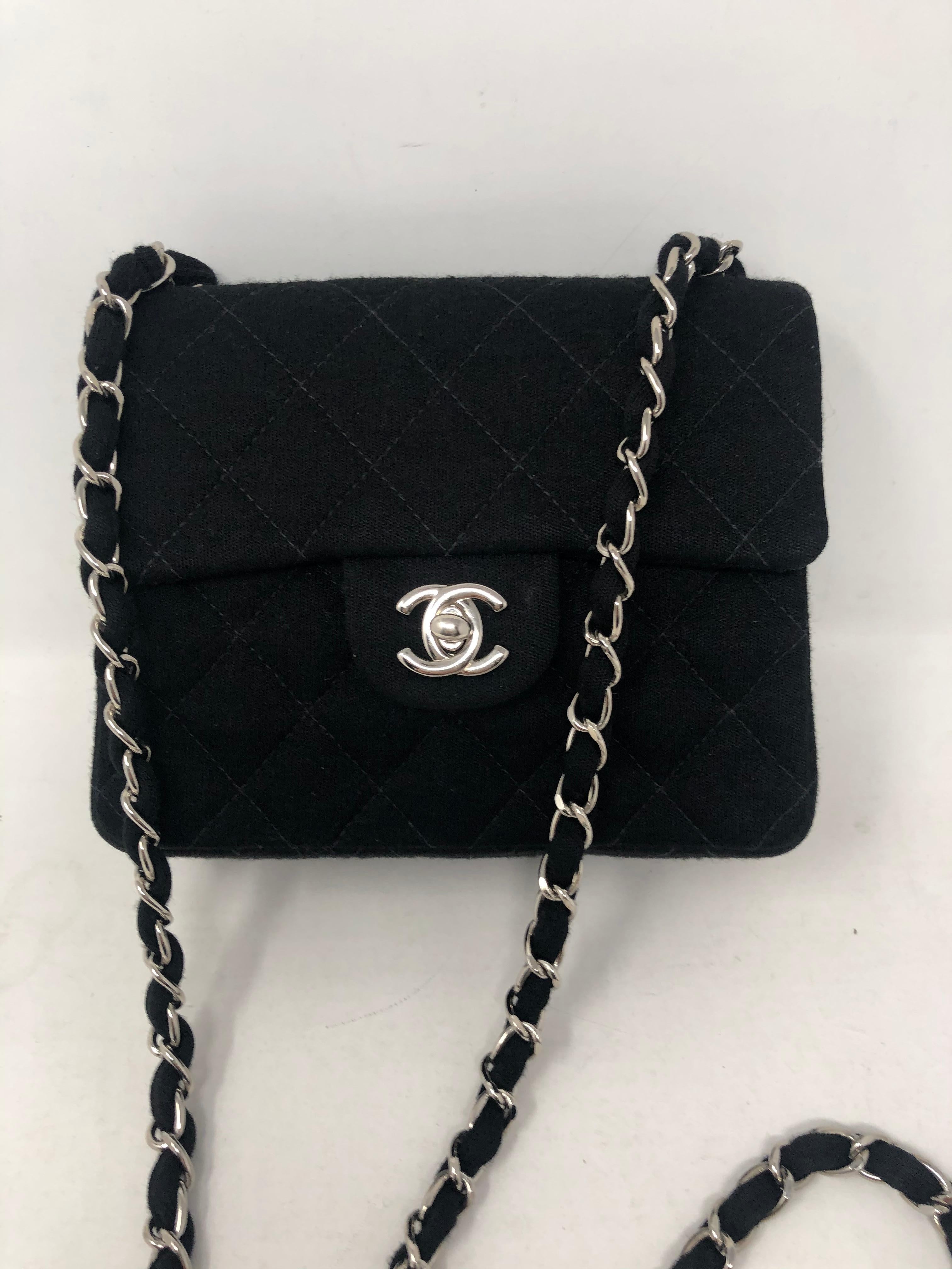 Chanel Black Jersey Cotton Mini Bag. Silver hardware crossbody bag. Not leather but made of fabric. Mint like new condition. Serial number inside bag. Guaranteed authentic. 