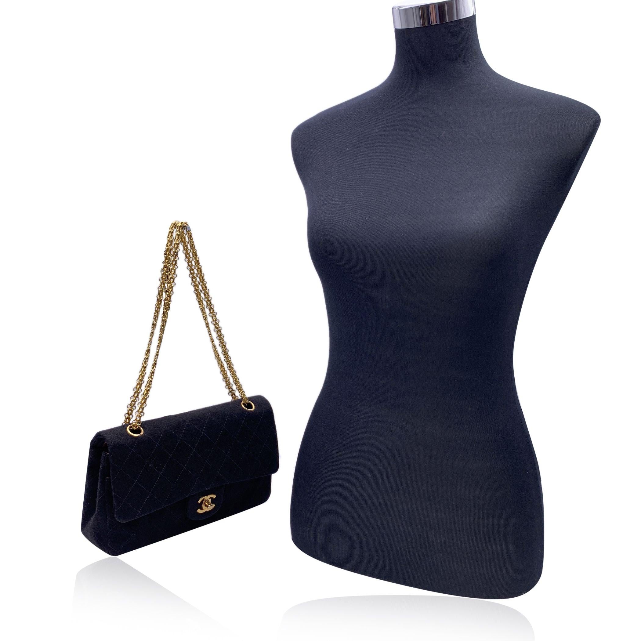 This beautiful Bag will come with a Certificate of Authenticity provided by Entrupy. The certificate will be provided at no further cost. Classic Chanel 2.55 Double flap bag in black quilted jersey fabric. Period/Era: 1994. Beautiful gold metal