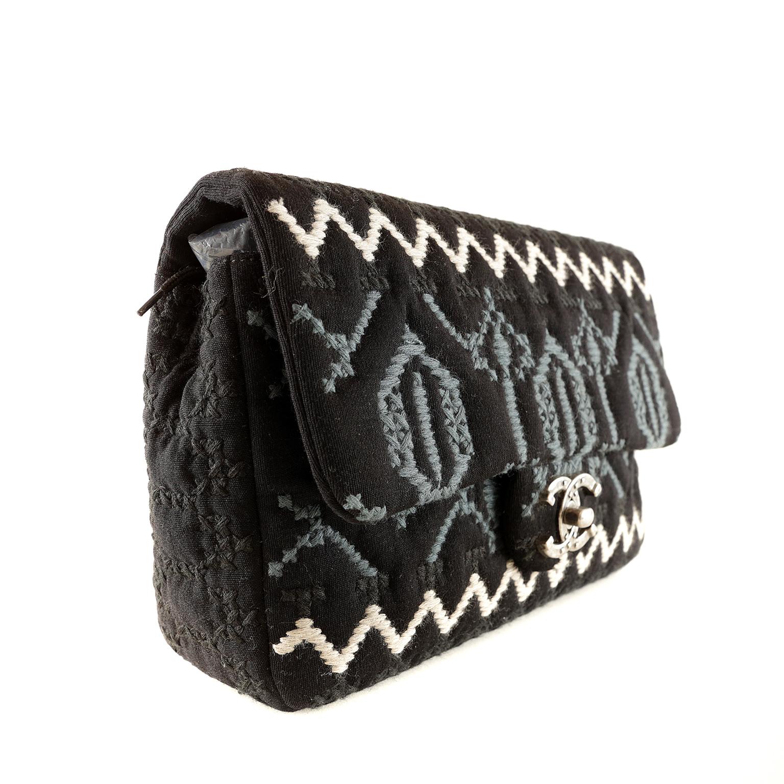 Chanel Black Jersey Embroidered Flap Bag- Pristine Condition; appears never carried
From the Paris- Dallas Métiers D’art Pre-Fall 2014 collection, it has a southwestern theme with embroidered top stitching and aged metal hardware. 
Large single flap