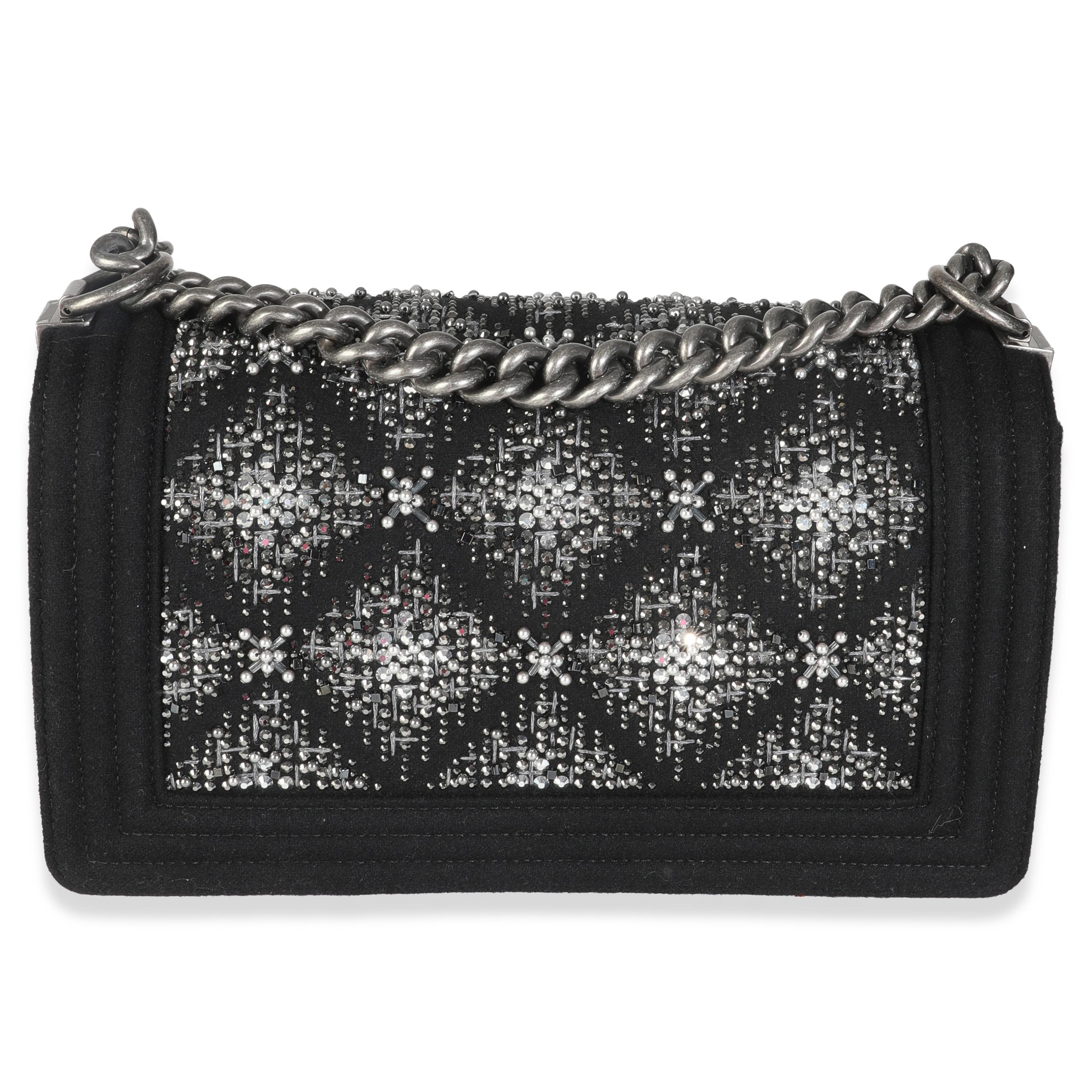 Listing Title: Chanel Black Jersey Strass Old Medium Boy Bag
SKU: Z147071
Condition: Pre-owned 
Condition Description: An instant classic, the Boy bag from Chanel was introduced in 2011. The quilted bag was designed by the late Karl Lagerfeld, who