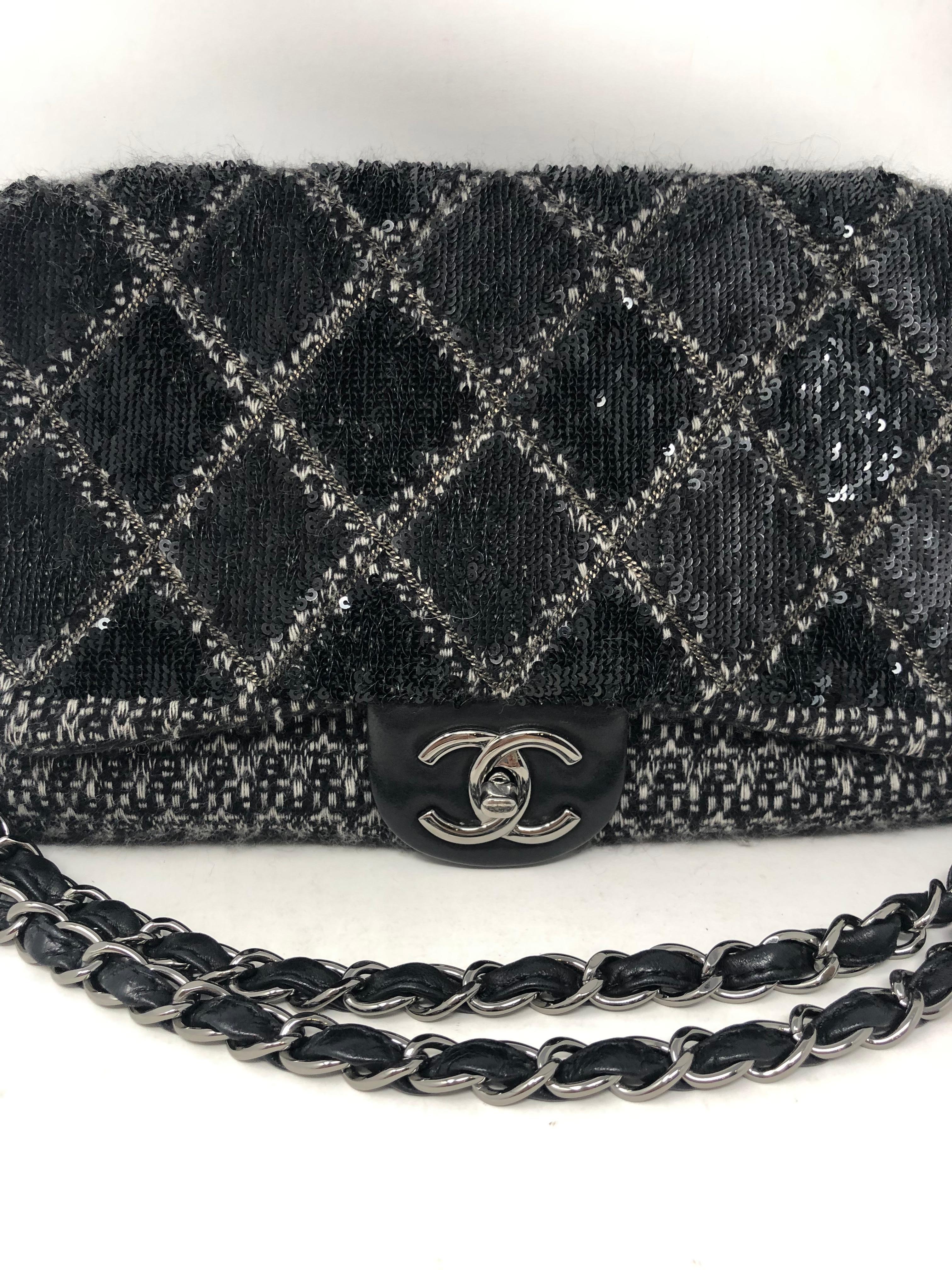 Chanel Black Jumbo Tweed Bag with Silver Hardware. Black diagonal tweed and leather Chanel bag. Excellent condition. Bag can be worn longer or doubled on the shoulder. Unique pattern and look. Leather interior. Guarnteed authentic. 