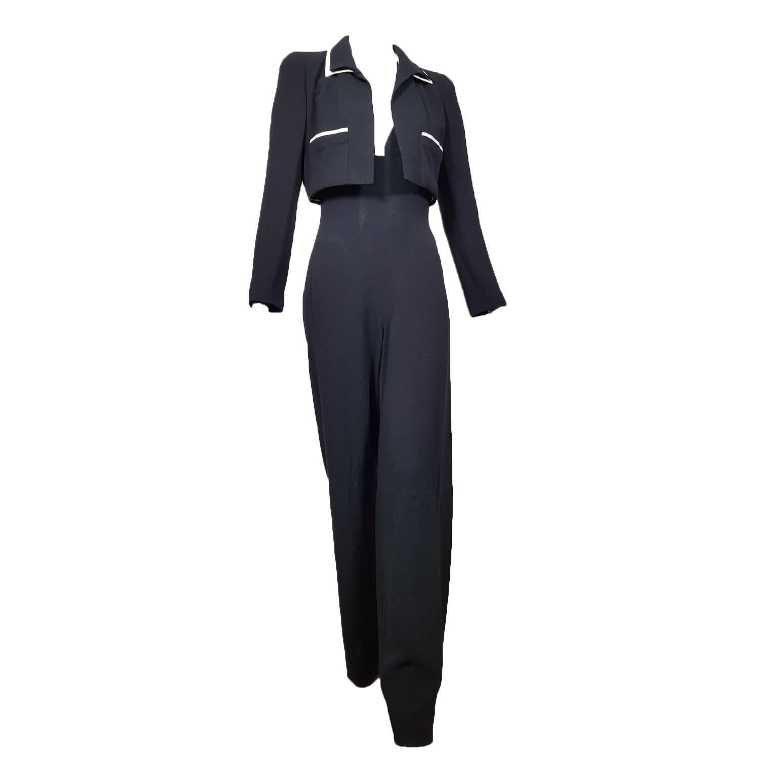 Chanel wide leg jumpsuit with jacket from S/S 1995. 
The short box-shaped jacket futures double collar detail, with CC buttons on the cuffs.
Wide leg overall with white piping detail on the front to the neck, adjustable back bow closure.
With unused