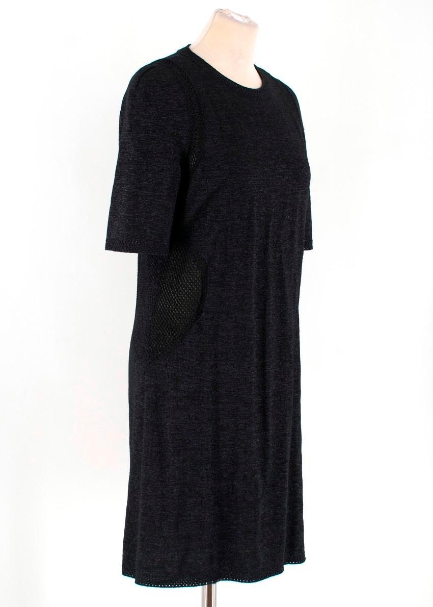 Chanel Black Knit Crochet Trim Dress
- Round neckline
- Short sleeves
- Straight shape
- Metallic fibres woven throughout
- Cut-out detail around the collar, cuffs, arms and sides


40% viscose, 25% wool, 13% linen, 12% polyamide

Size FR 38

All