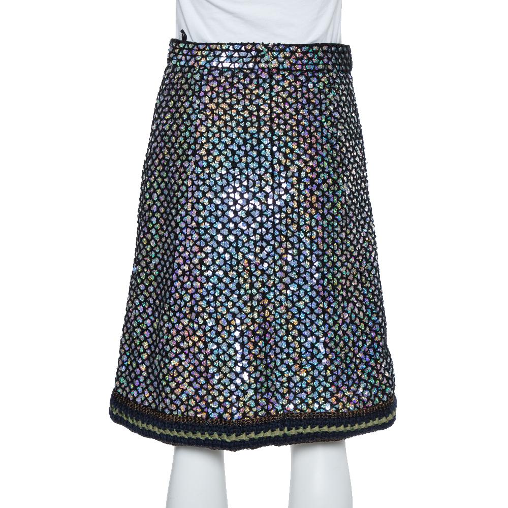 This skirt from Chanel will help you outline a glamorous look. It comes made from a blend of fine quality fabrics and features a sequin embellished knit design. It has been styled with a contrasting bottom hem and is equipped with a zip closure. It