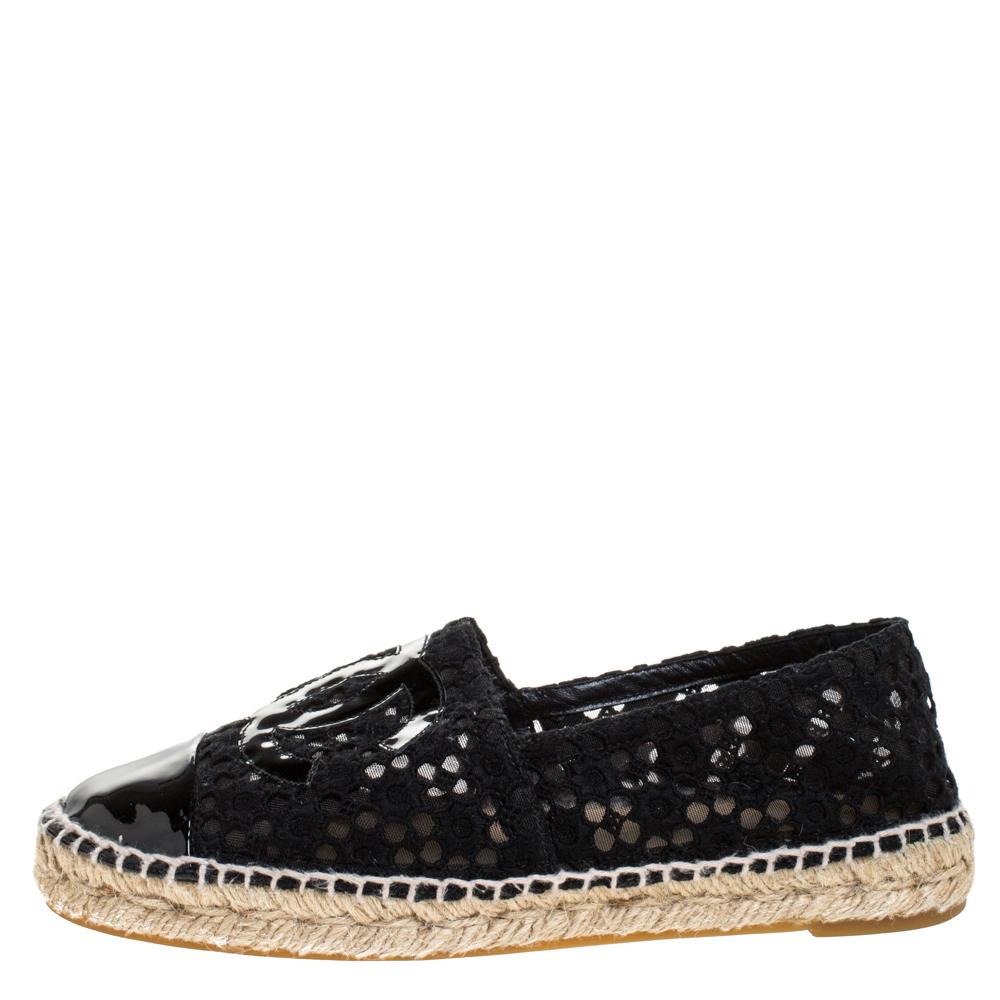Step out in style every day with these gorgeous espadrilles from Chanel. Featuring a pretty lace exterior, this round-toe pair is completed with braided jute details and patent leather details on the uppers. Slip these on with shorts and dresses.

