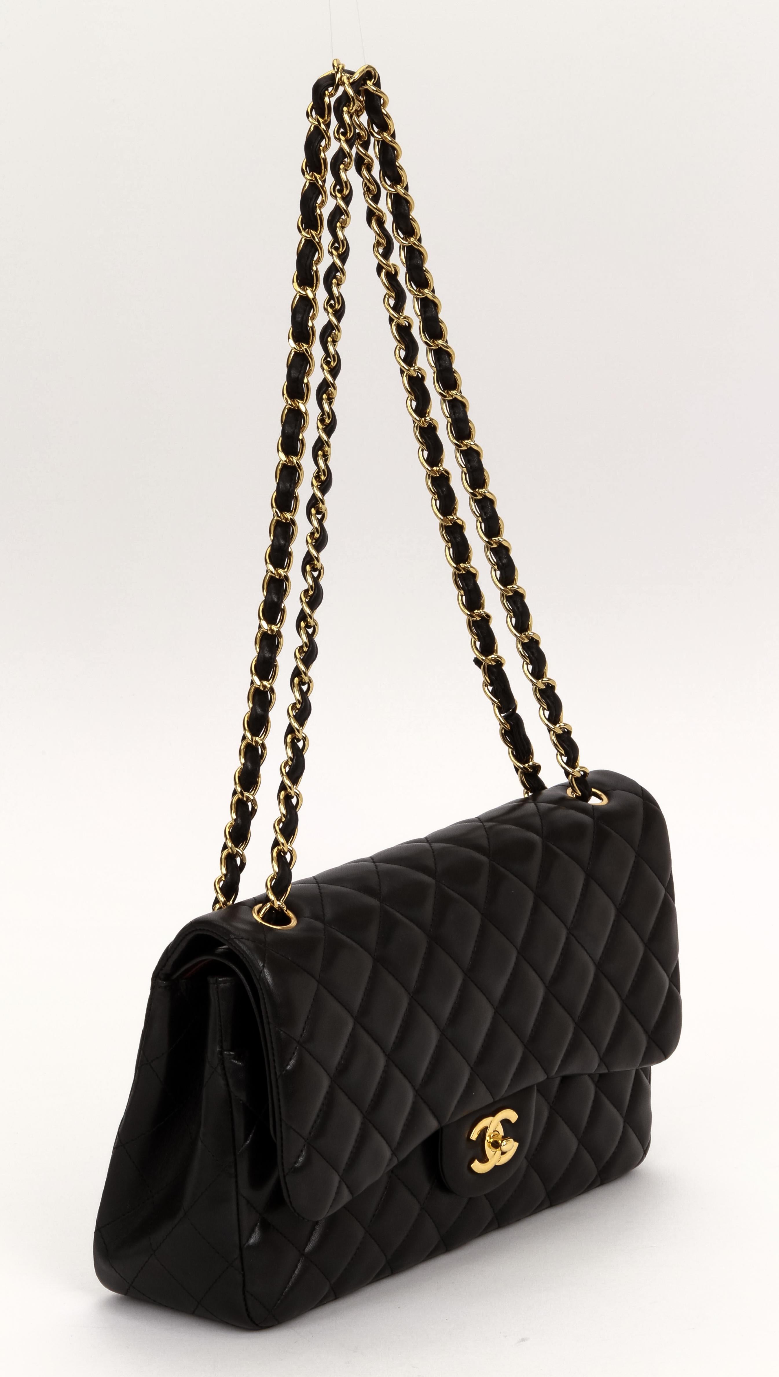 Chanel excellent condition black lambskin double flap with gold tone hardware. Shoulder drop 10