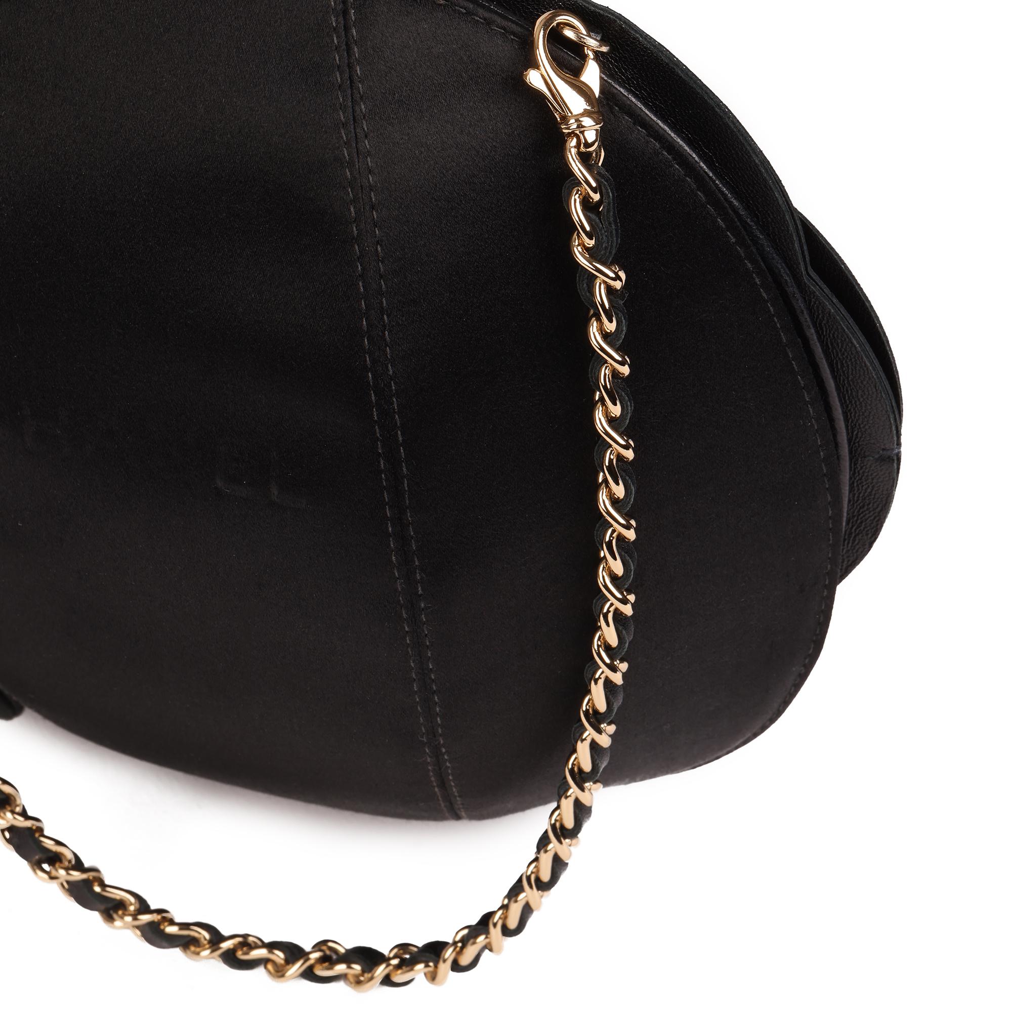 CHANEL
Black Lambskin Camellia Clutch-on-Chain COC

Serial Number: 7492899
Age (Circa): 2003
Accompanied By: Chanel Dust Bag 
Authenticity Details: Serial Sticker (Made in France)
Gender: Ladies
Type: Top Handle

Colour: Black
Hardware: