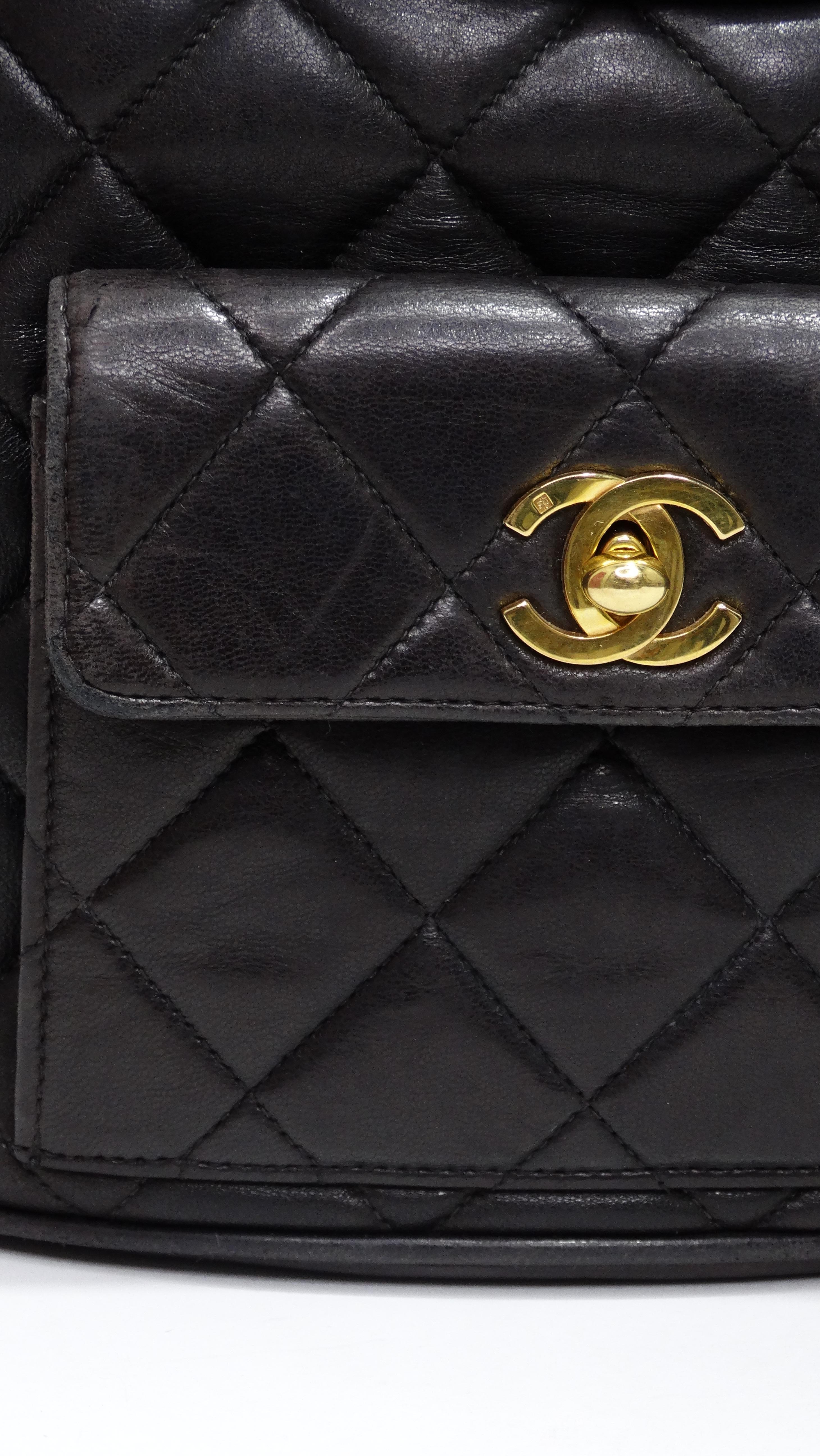 Get your hands on one of the most classic Chanel gems you can find! This is a VINTAGE Chanel backpack featured in a beautiful black lambskin quilted leather. From the 1990's, it is still in great condition and is ready for its next life! It is