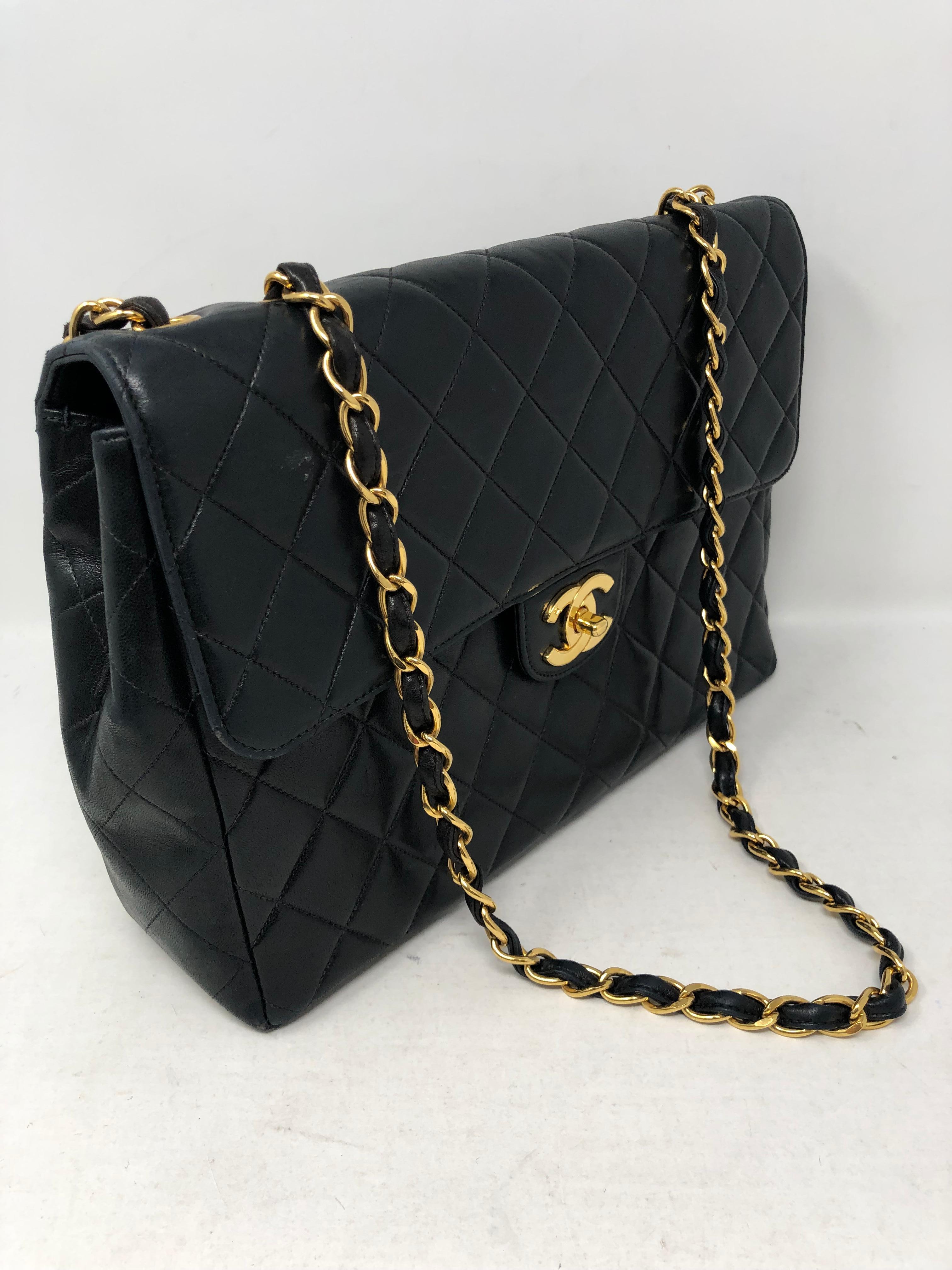 Chanel Black Lambskin Leather Jumbo. Vintage Jumbo Matelasse with gold hardware. Can be worn as crossbody or doubled strap shoulder bag. Classic style and Collector's piece. Black leather interior. Includes authenticity card and dust cover. Good