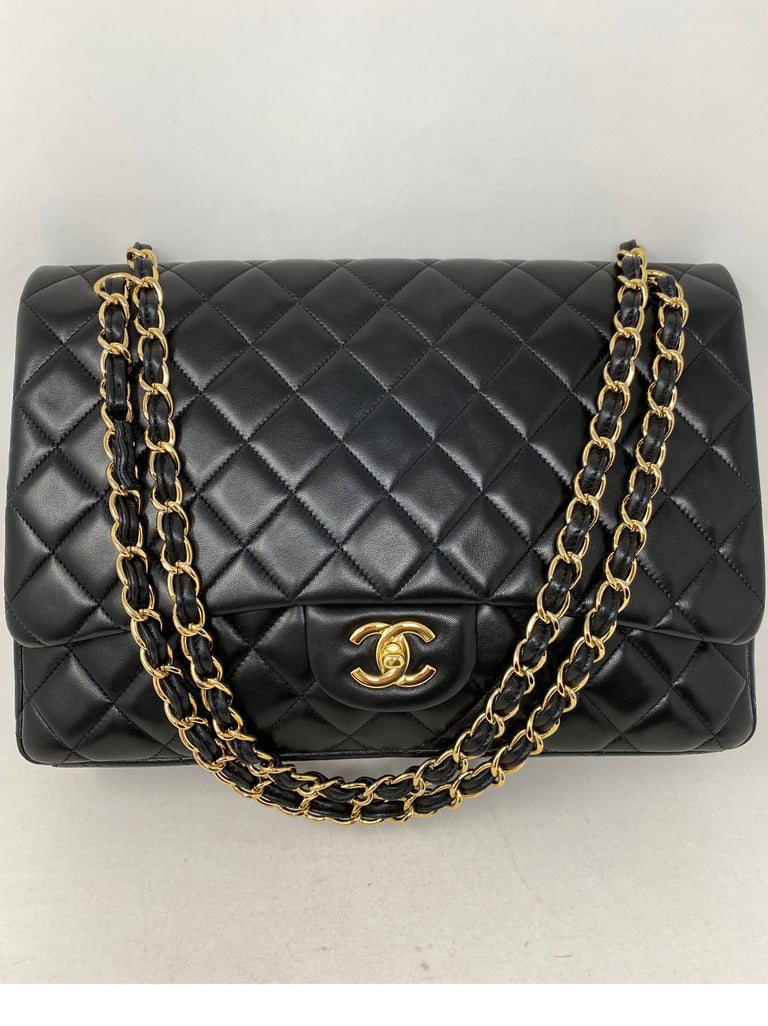 Chanel Black Maxi Single Flap Bag. Black lambskin leather with gold hardware. Most coveted combo from Chanel. Classic bags are going up. Can be worn crossbody or doubled as a shoulder bag. Mint condition like new. Series 14 includes authenticity